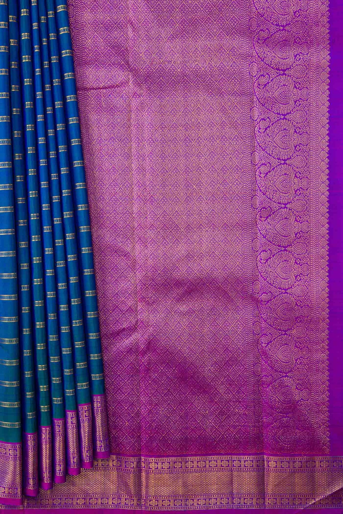 Pleats and pallu of Peacock Blue Dual Tone Kanchipuram Silk Saree with Stripes on the body and Zari Border