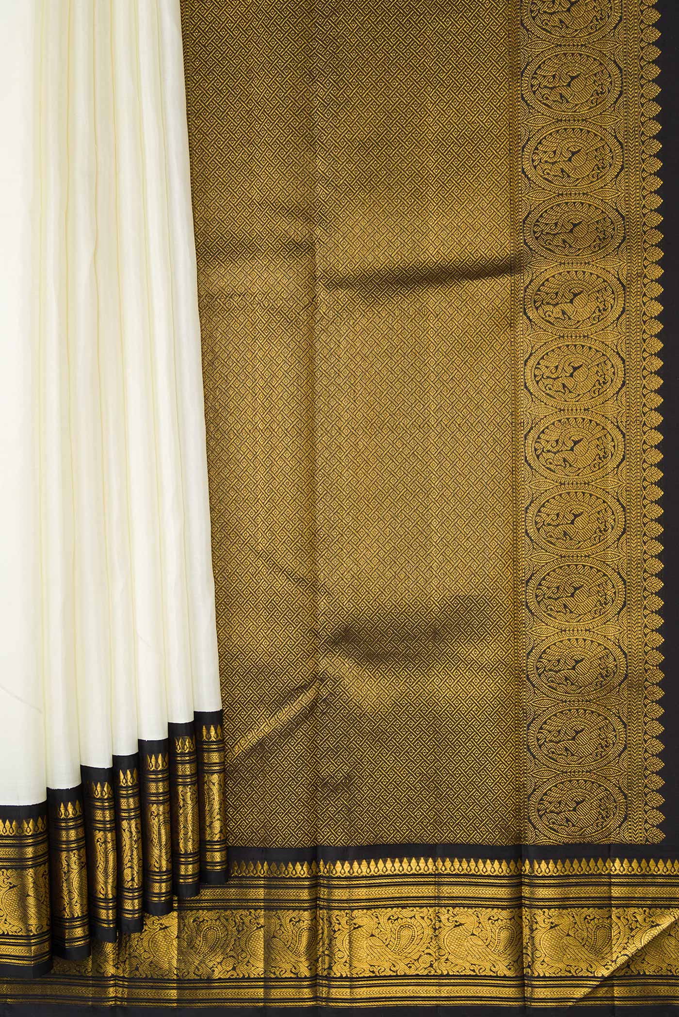 Pleats and pallu of Pure Silk Pure Zari White Dual Tone Kanjivaram Saree with Plain Body and Zari Border. 