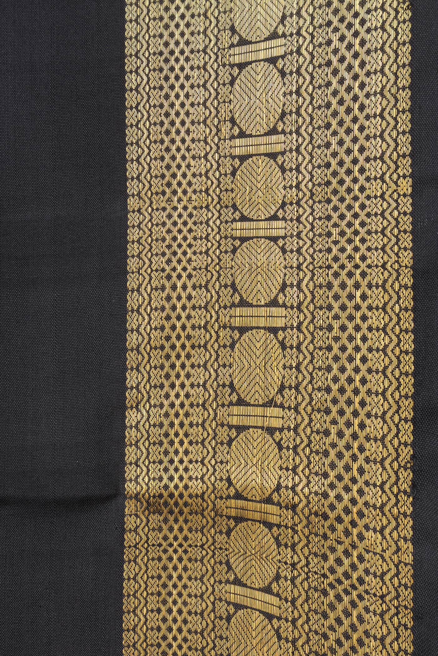 Border image of Black Dual Tone Kanchipuram Silk Saree with Zari Butta on the body and Zari Border. 