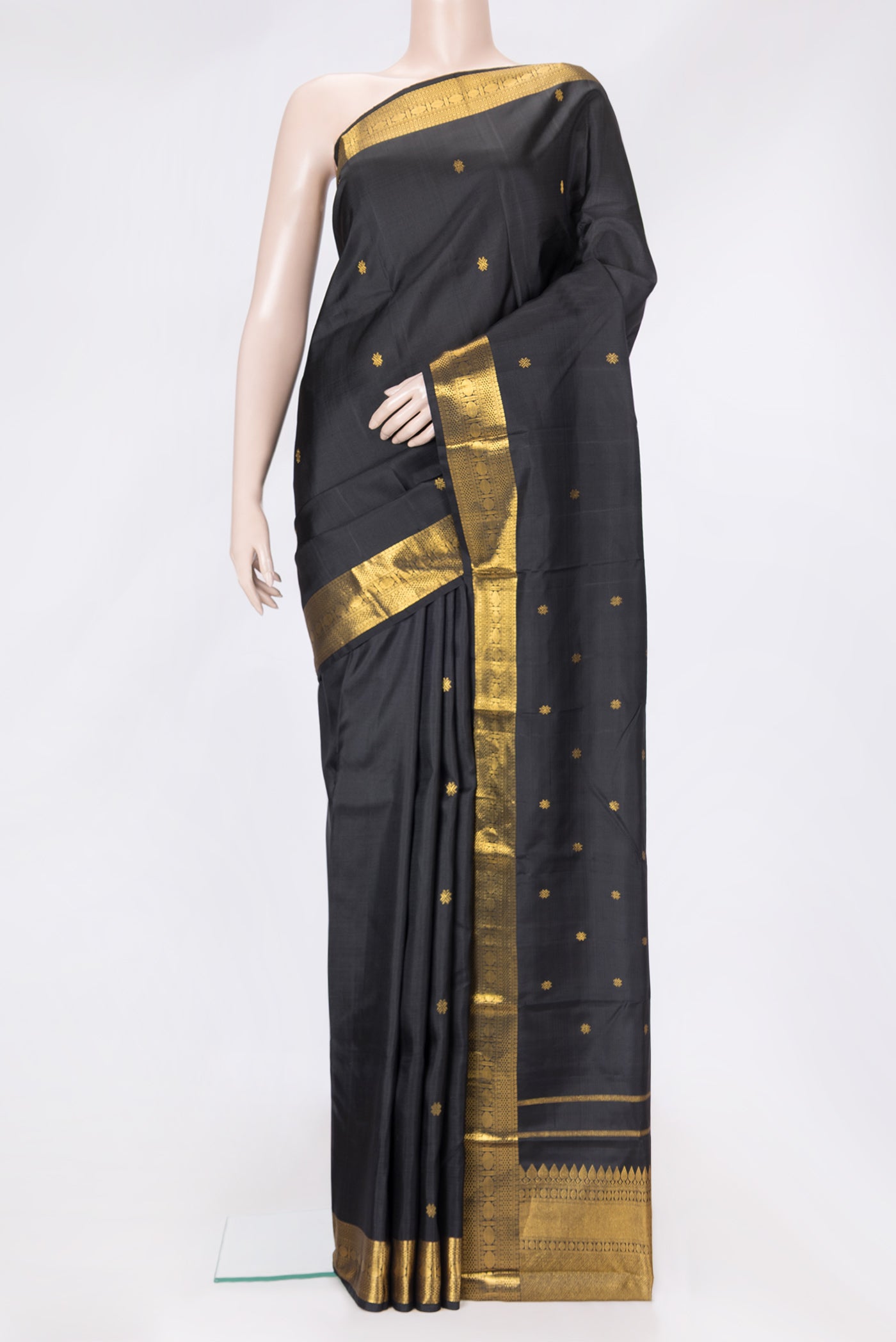 Black Dual Tone Kanchipuram Silk Saree with Zari Butta on the body and Zari Border.  displayed on a mannequin