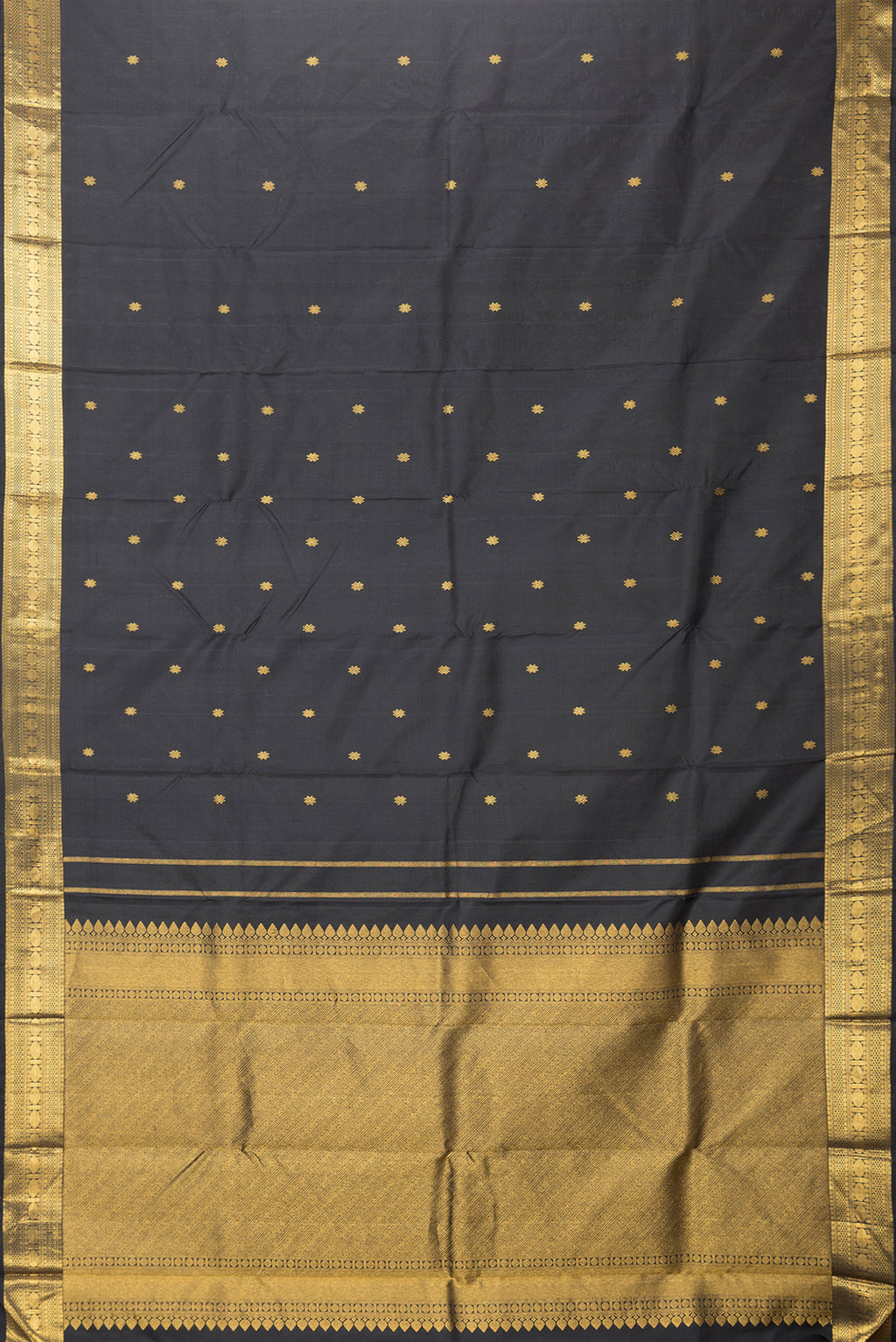 Flat view of Black Dual Tone Kanchipuram Silk Saree with Zari Butta on the body and Zari Border. 