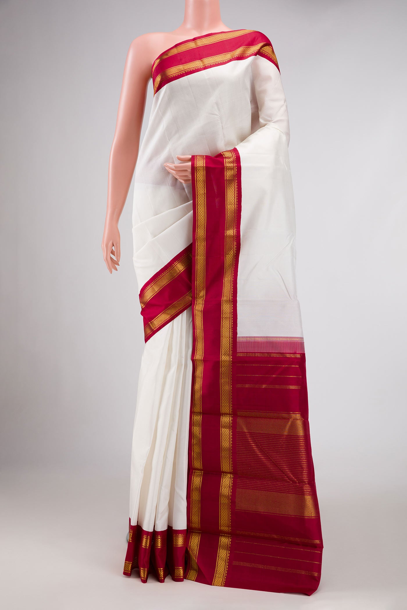 White Dual Tone Kanjivaram Silk Saree with Plain Body and Zari Border.  displayed on a mannequin