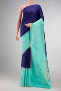 Navy Blue Dual Tone Kanchipuram Silk Saree with Checked design on the body and Zari Border displayed on a mannequin