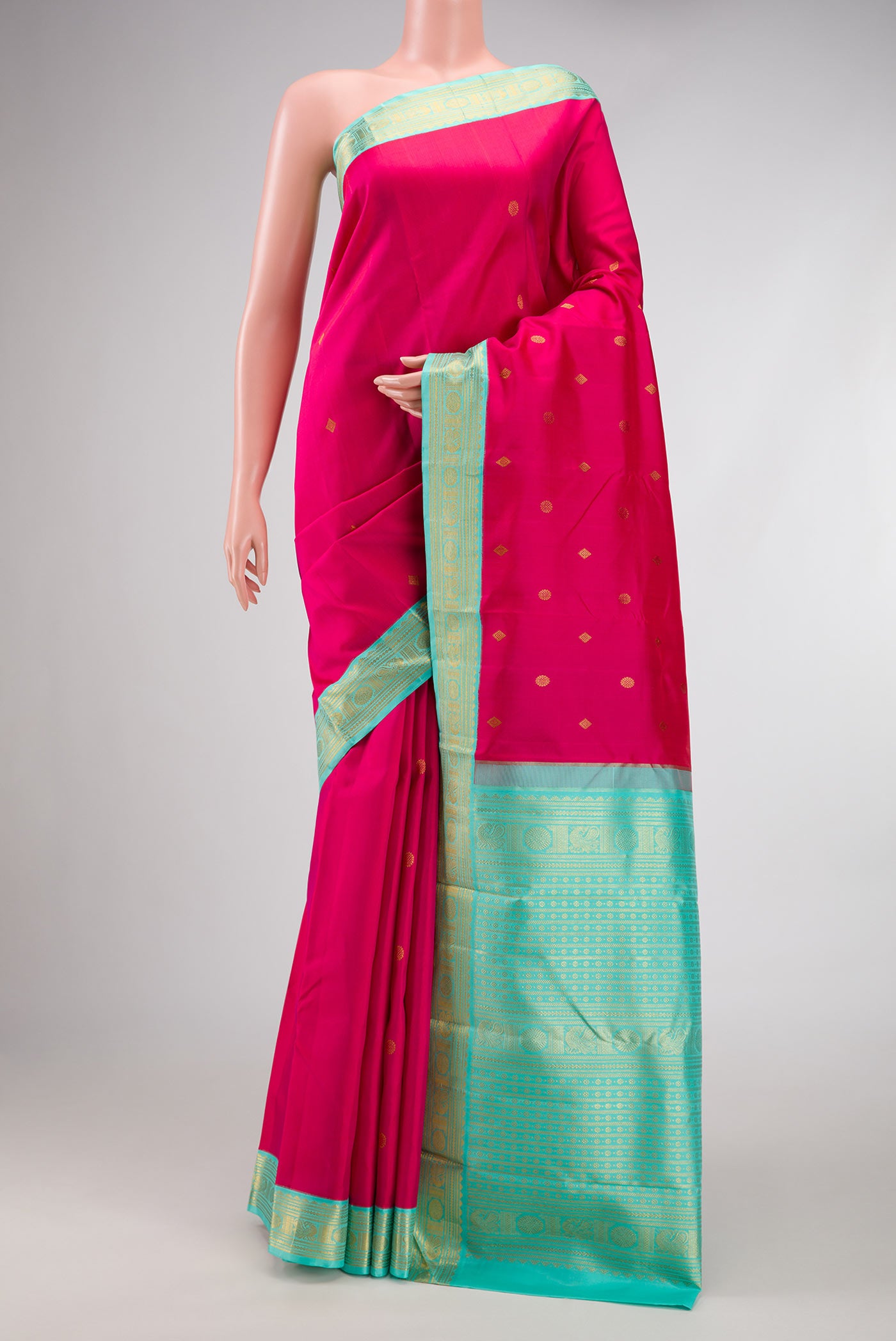 Pink Dual Tone Kanjivaram Silk Saree with Zari Butta on the body and Zari Border.  displayed on a mannequin