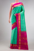 Pure Silk Pure Zari Sea Green Dual Tone Kanjivaram Saree with Plain Body and Zari Border.  displayed on a mannequin