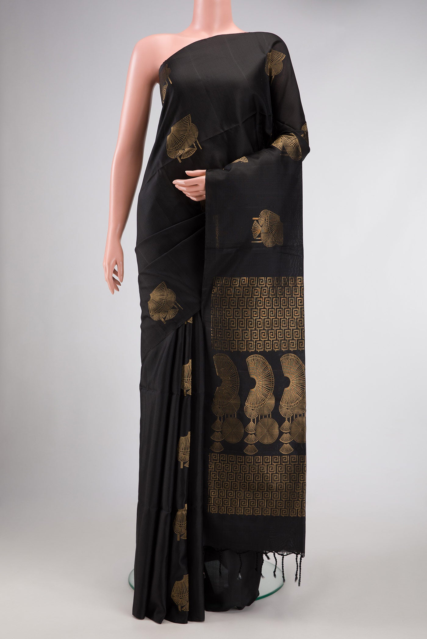 Black Dual Tone Soft Silk Saree with Zari Butta on the body and Without Border.  displayed on a mannequin