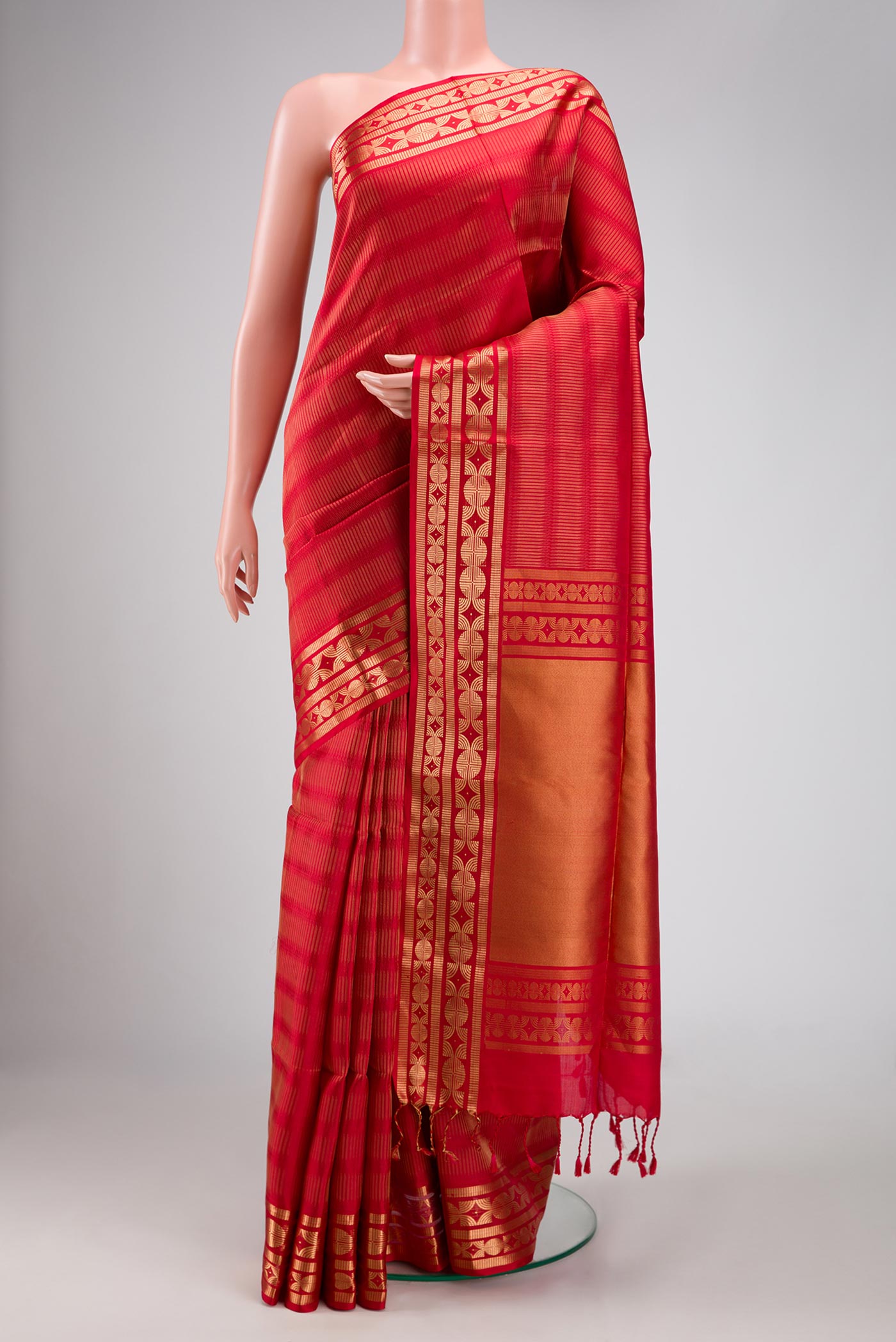 Red Dual Tone Soft Silk Saree with Zari Brocade on the body and Zari Border.  displayed on a mannequin