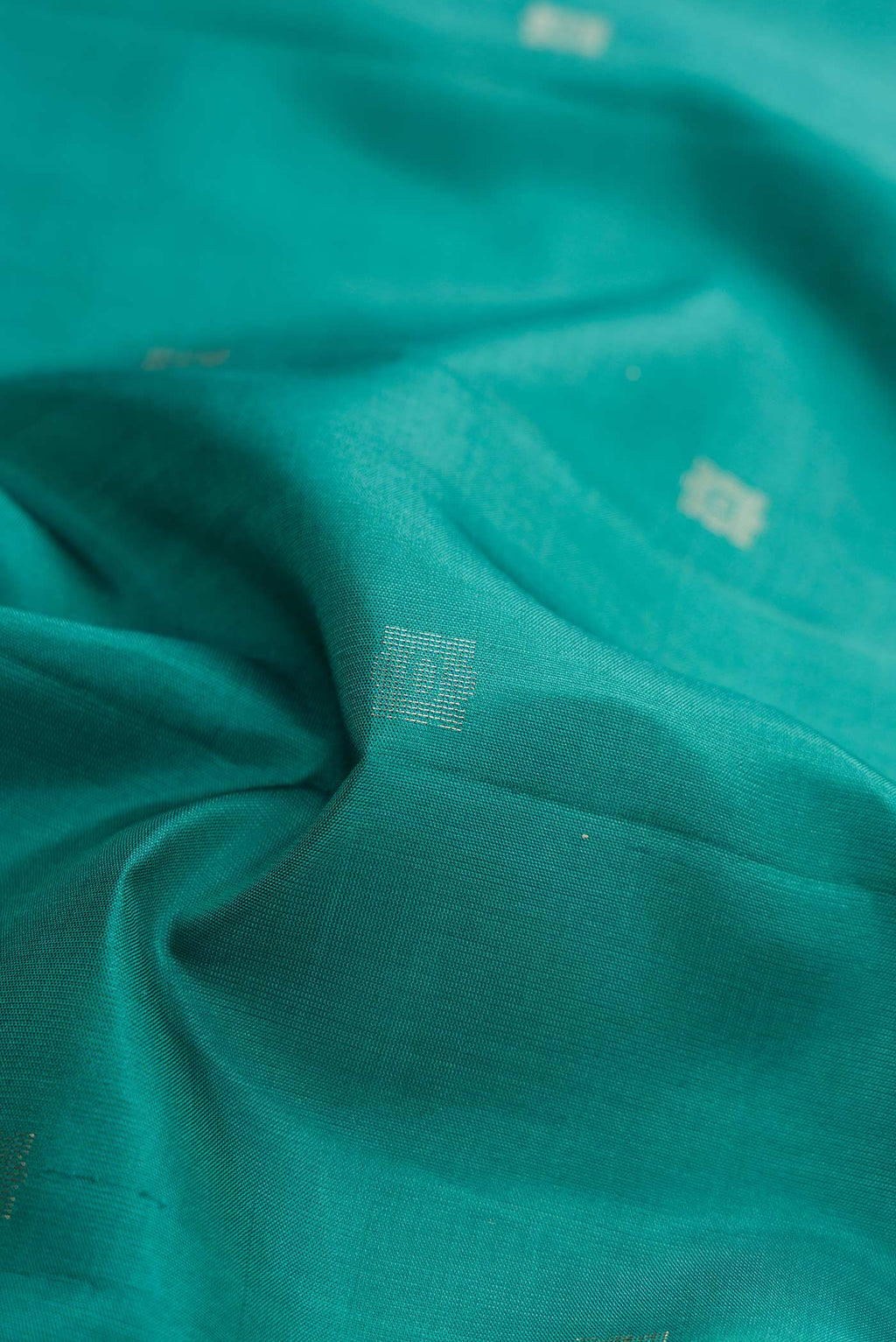 Close up of Davys Grey Dual Tone Soft Silk Saree with Zari Butta on the body and Fancy Border.  displaying folds