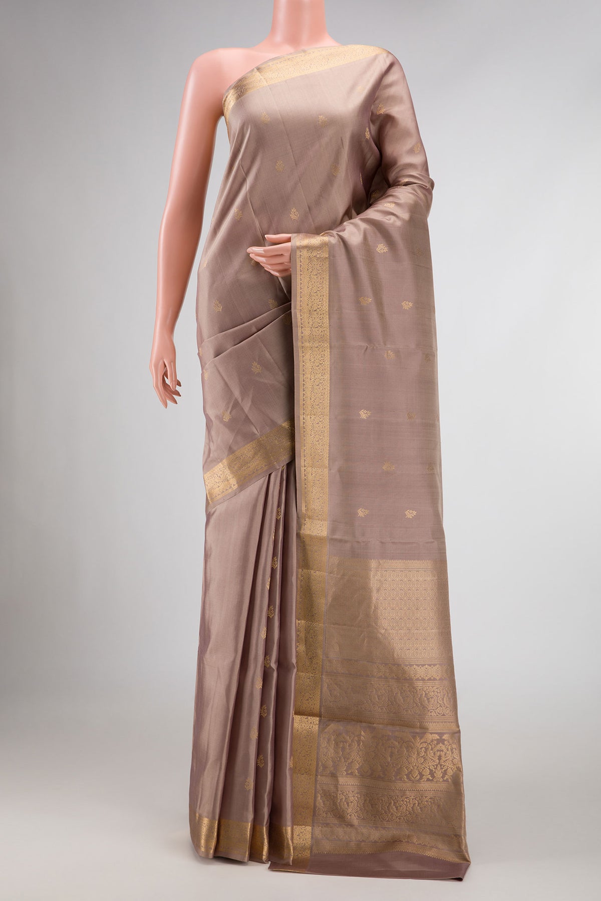 Rose Gold Dual Tone Soft Silk Saree with Zari Butta on the body and Zari Border displayed on a mannequin