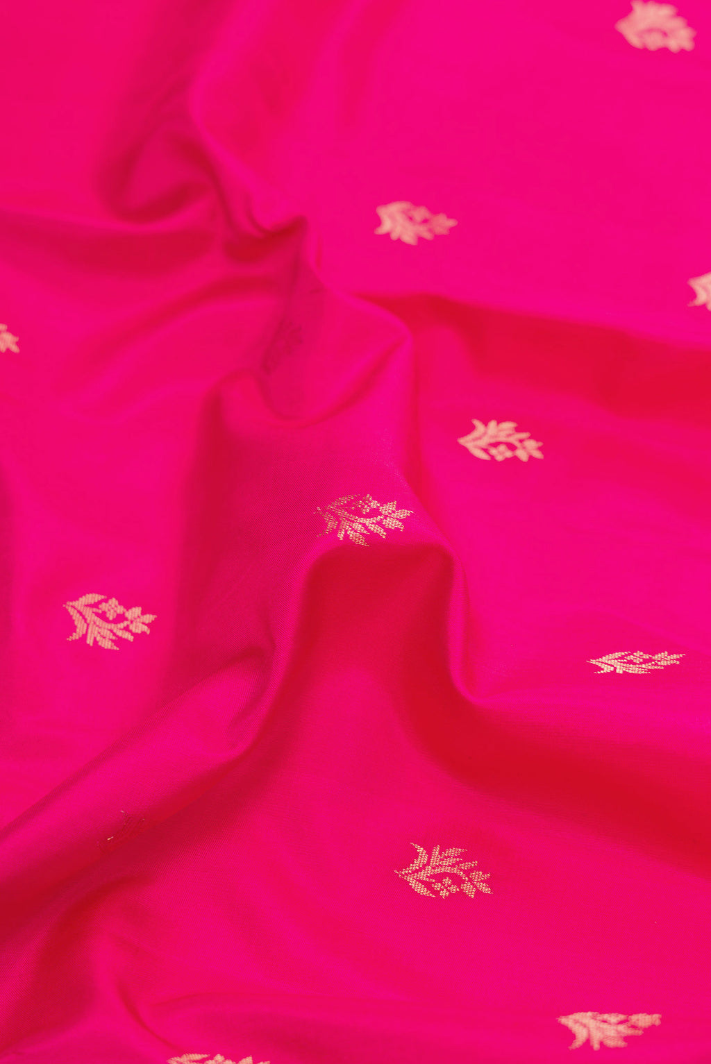 Close up of Dark Pink Dual Tone Soft Silk Saree with Zari Butta on the body and Zari Border displaying folds