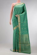 Green Dual Tone Soft Silk Saree with Zari Butta on the body and Zari Border.  displayed on a mannequin