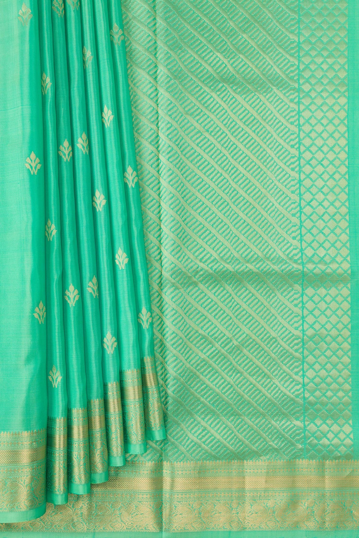 Pleats and pallu of Parrot Green Dual Tone Soft Silk Saree with Zari Butta on the body and Zari Border. 