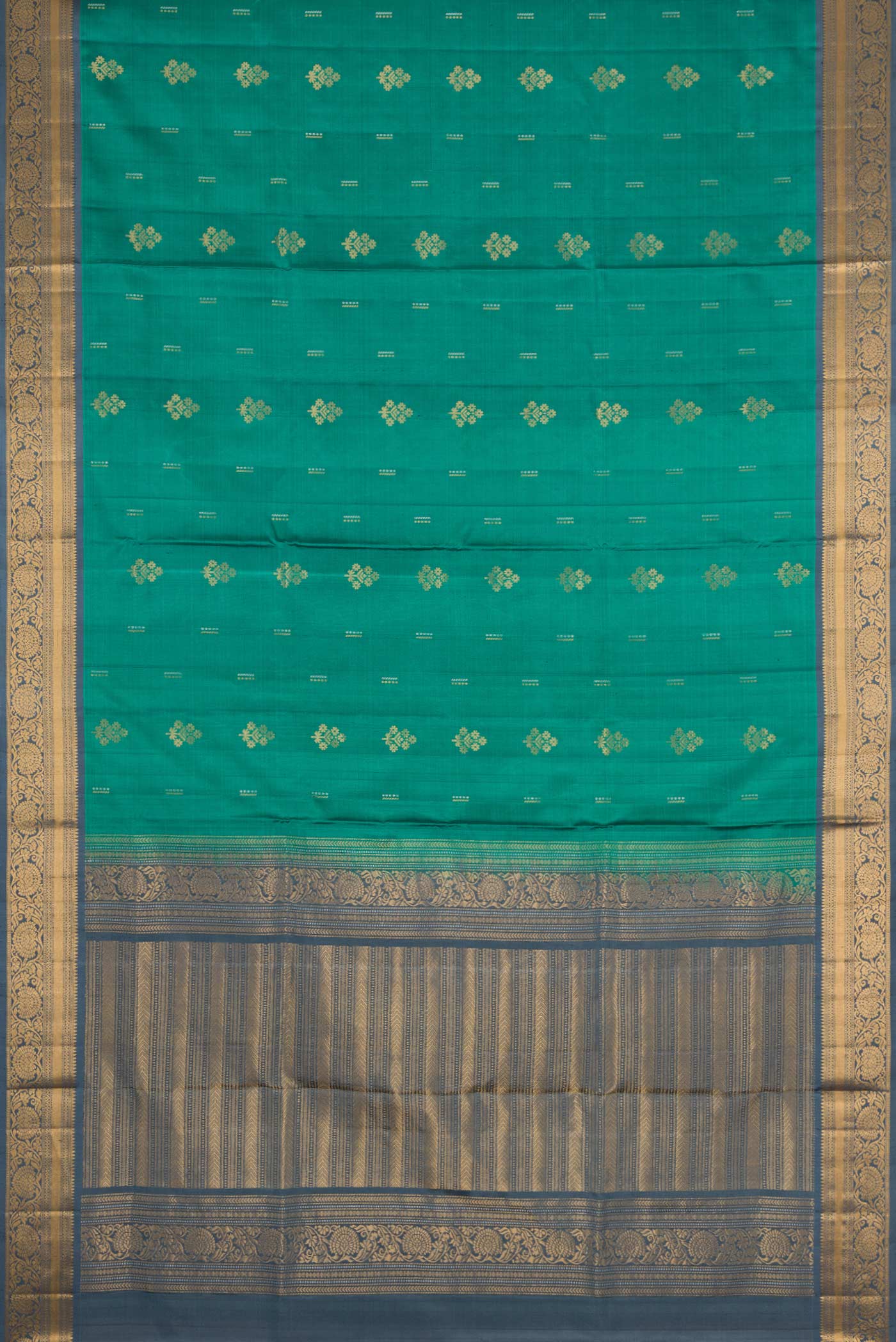 Flat view of Green Dual Tone Soft Silk Saree with Zari Butta on the body and Zari Border. 