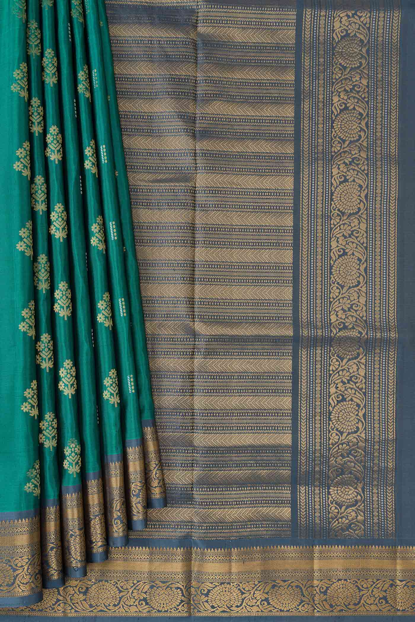 Pleats and pallu of Green Dual Tone Soft Silk Saree with Zari Butta on the body and Zari Border. 