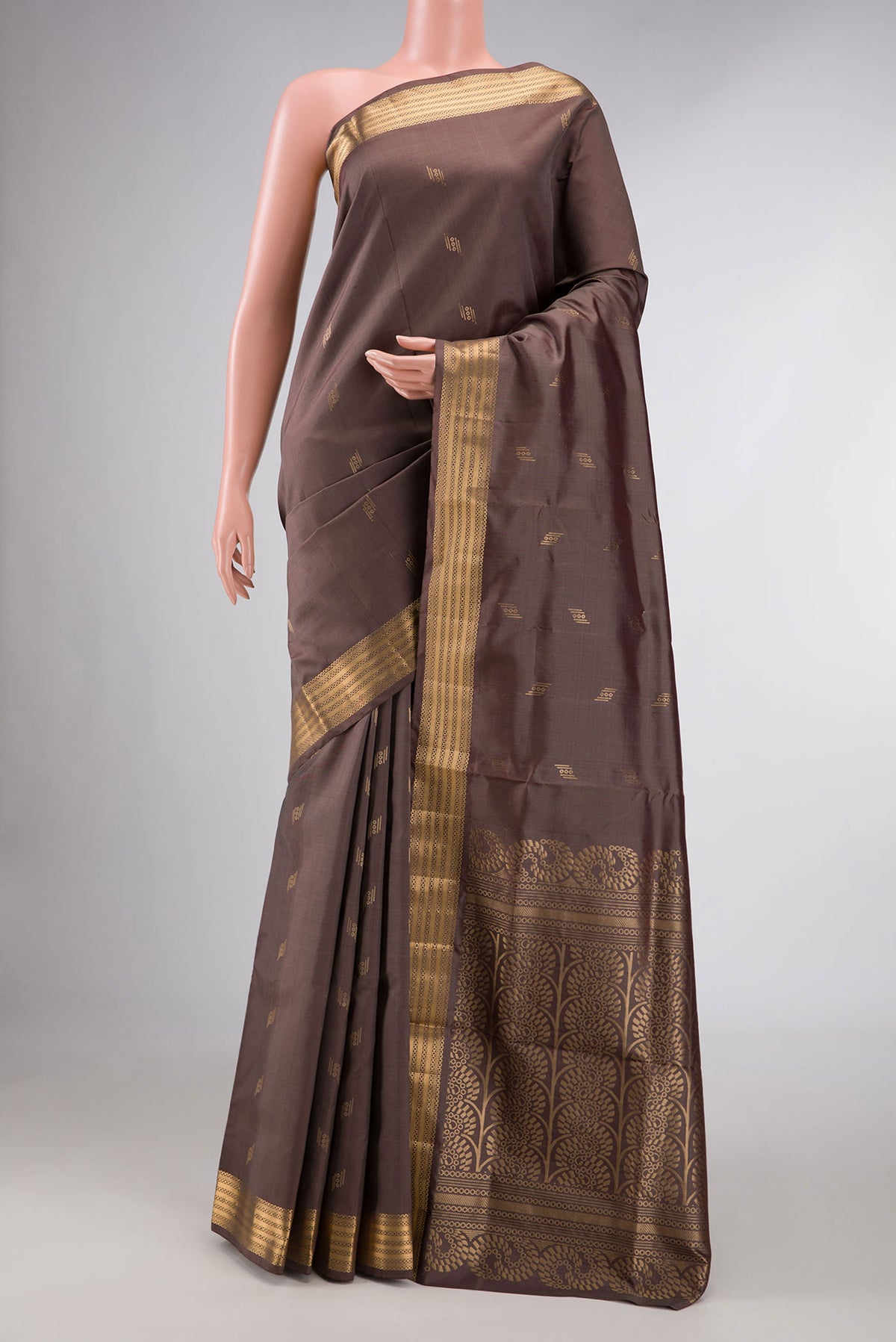 Brown Dual Tone Soft Silk Saree with Zari Butta on the body and Zari Border displayed on a mannequin