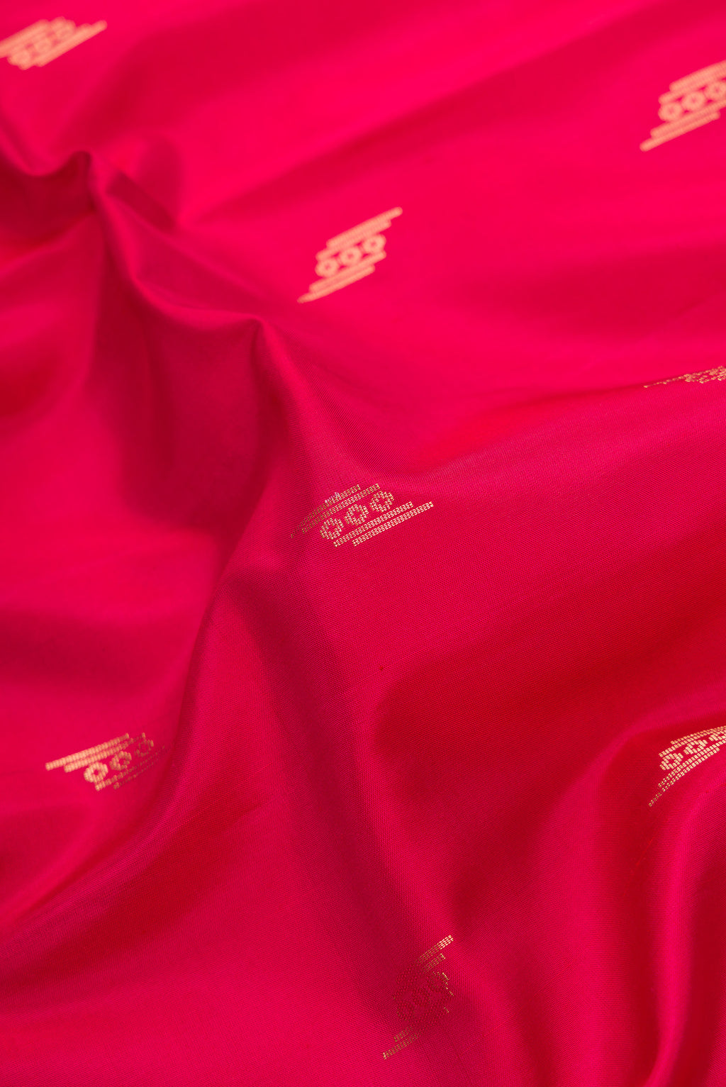 Close up of Dark Pink Dual Tone Soft Silk Saree with Zari Butta on the body and Zari Border.  displaying folds
