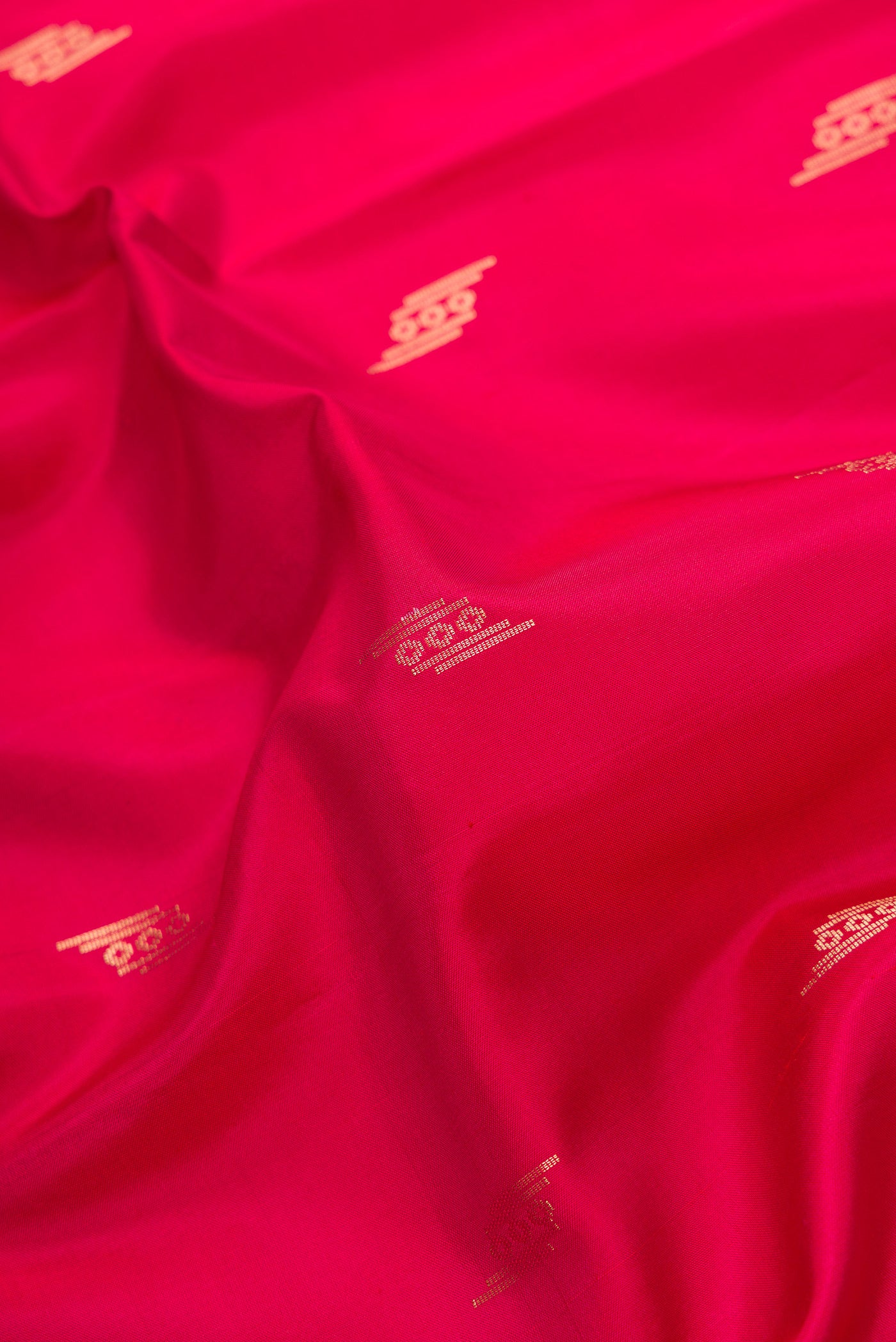 Close up of Dark Pink Dual Tone Soft Silk Saree with Zari Butta on the body and Zari Border.  displaying folds