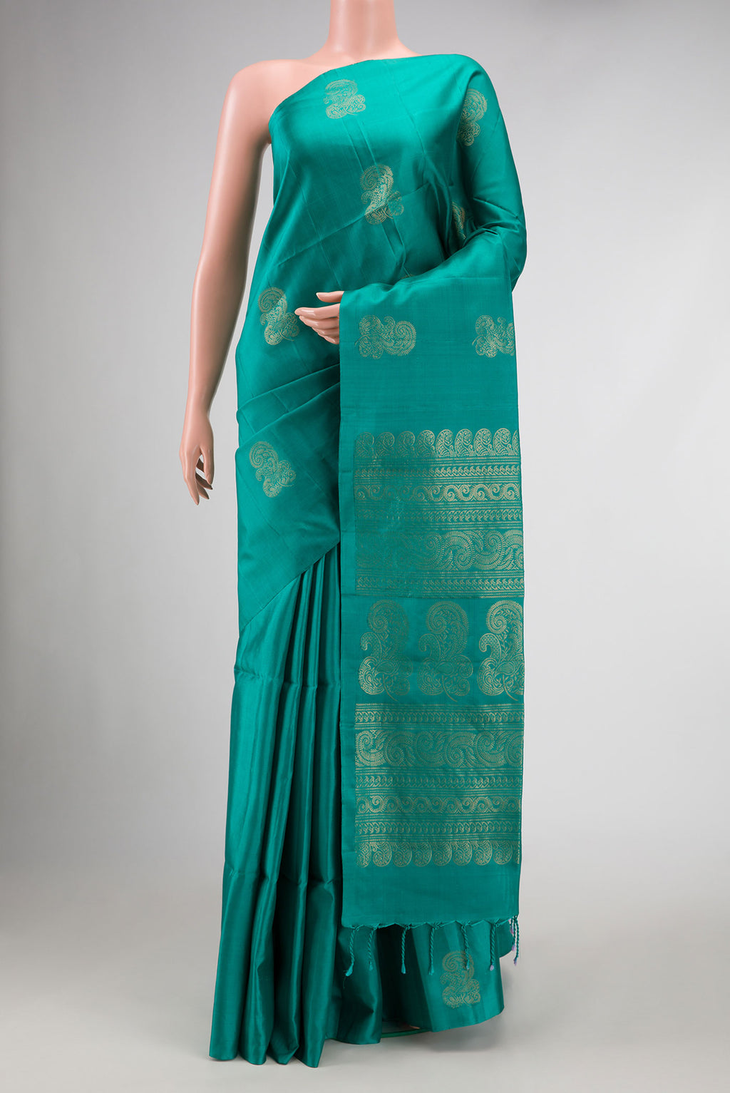 Green Dual Tone Soft Silk Saree with Zari Butta on the body and Without Border.  displayed on a mannequin