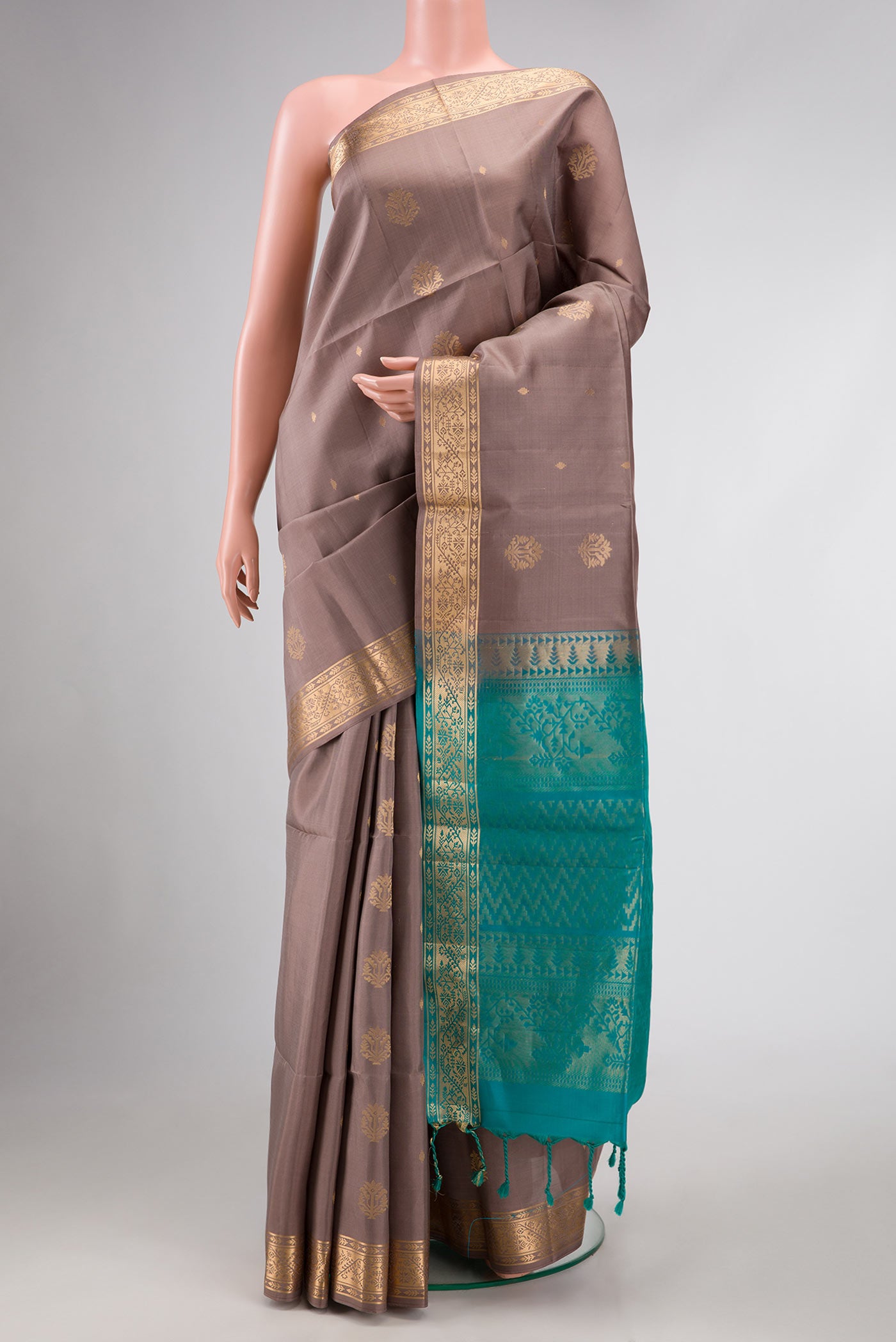 Brown Dual Tone Soft Silk Saree with Zari Butta on the body and Zari Border.  displayed on a mannequin