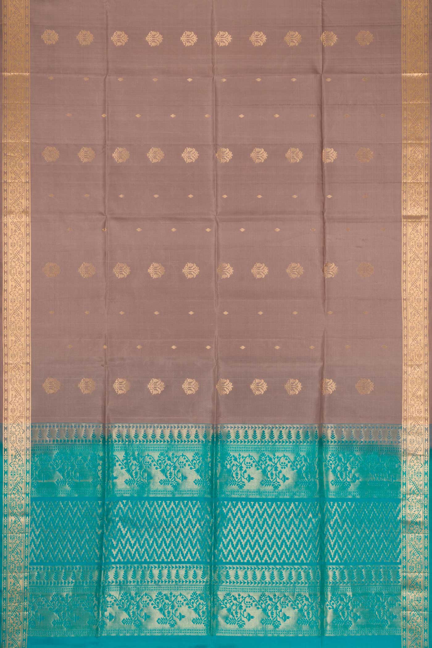 Flat view of Brown Dual Tone Soft Silk Saree with Zari Butta on the body and Zari Border. 