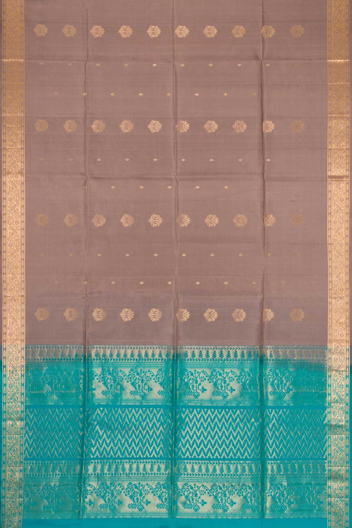 Flat view of Brown Dual Tone Soft Silk Saree with Zari Butta on the body and Zari Border. 