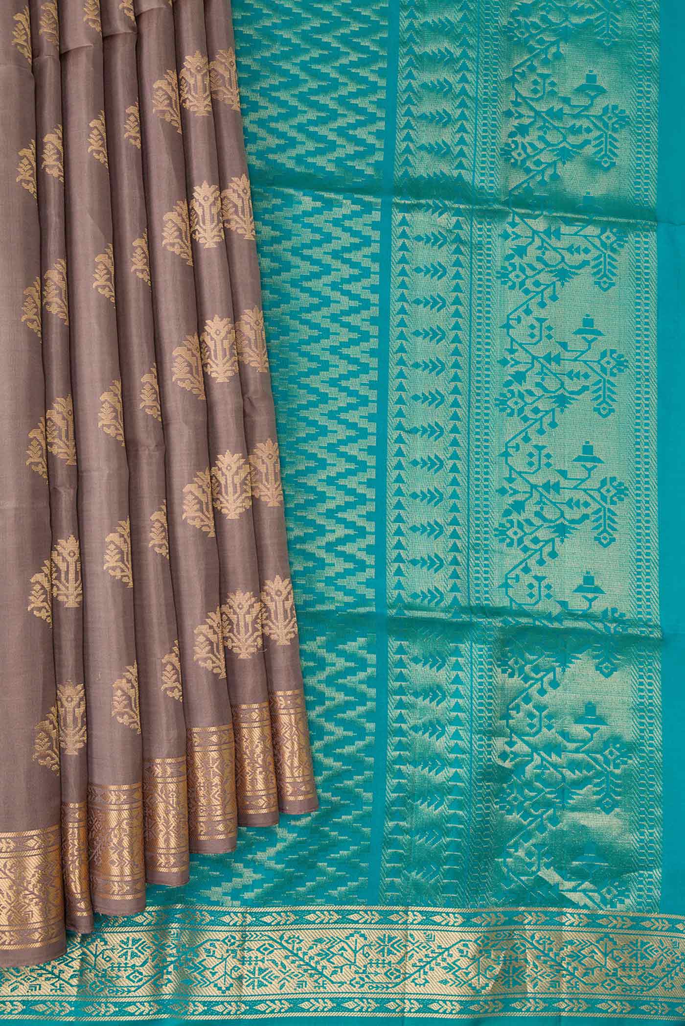 Pleats and pallu of Brown Dual Tone Soft Silk Saree with Zari Butta on the body and Zari Border. 