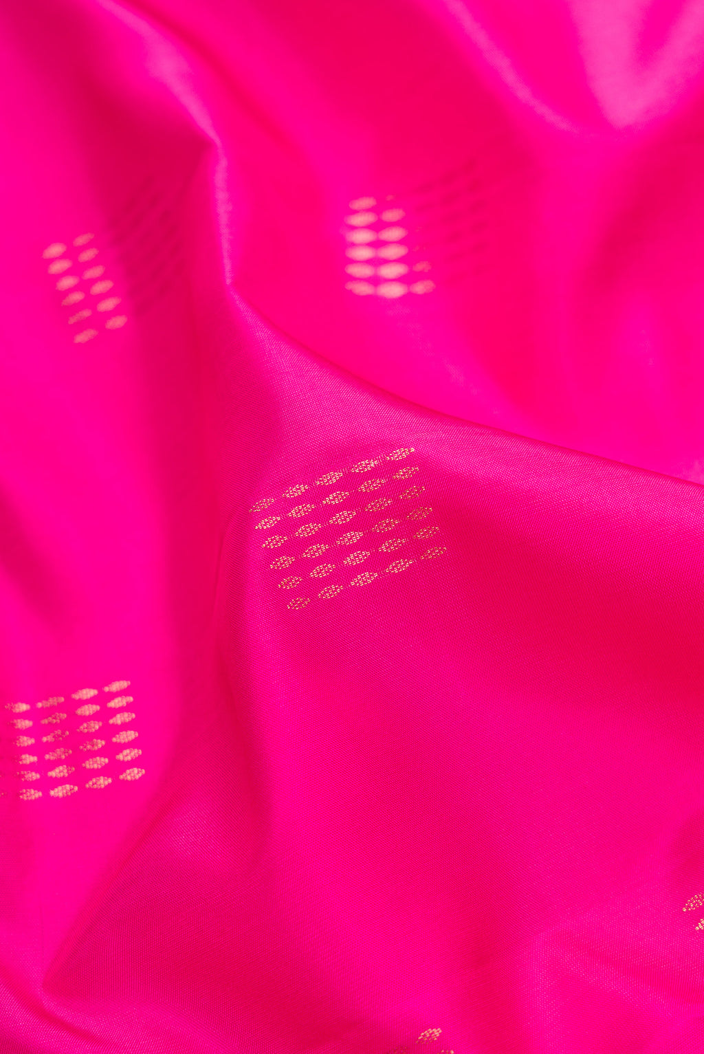Close up of Pink Dual Tone Soft Silk Saree with Zari Butta on the body and Fancy Border.  displaying folds