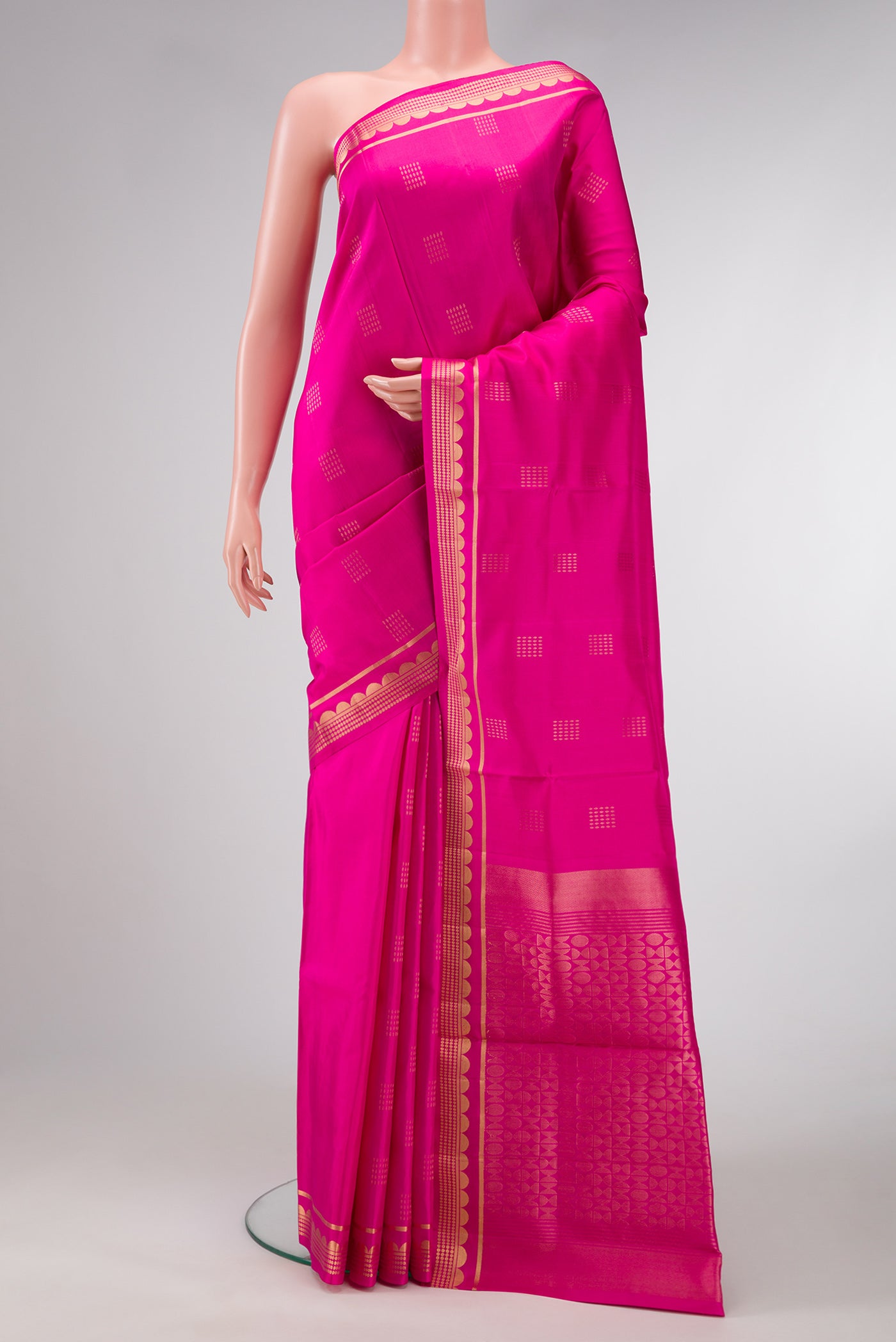 Pink Dual Tone Soft Silk Saree with Zari Butta on the body and Fancy Border.  displayed on a mannequin