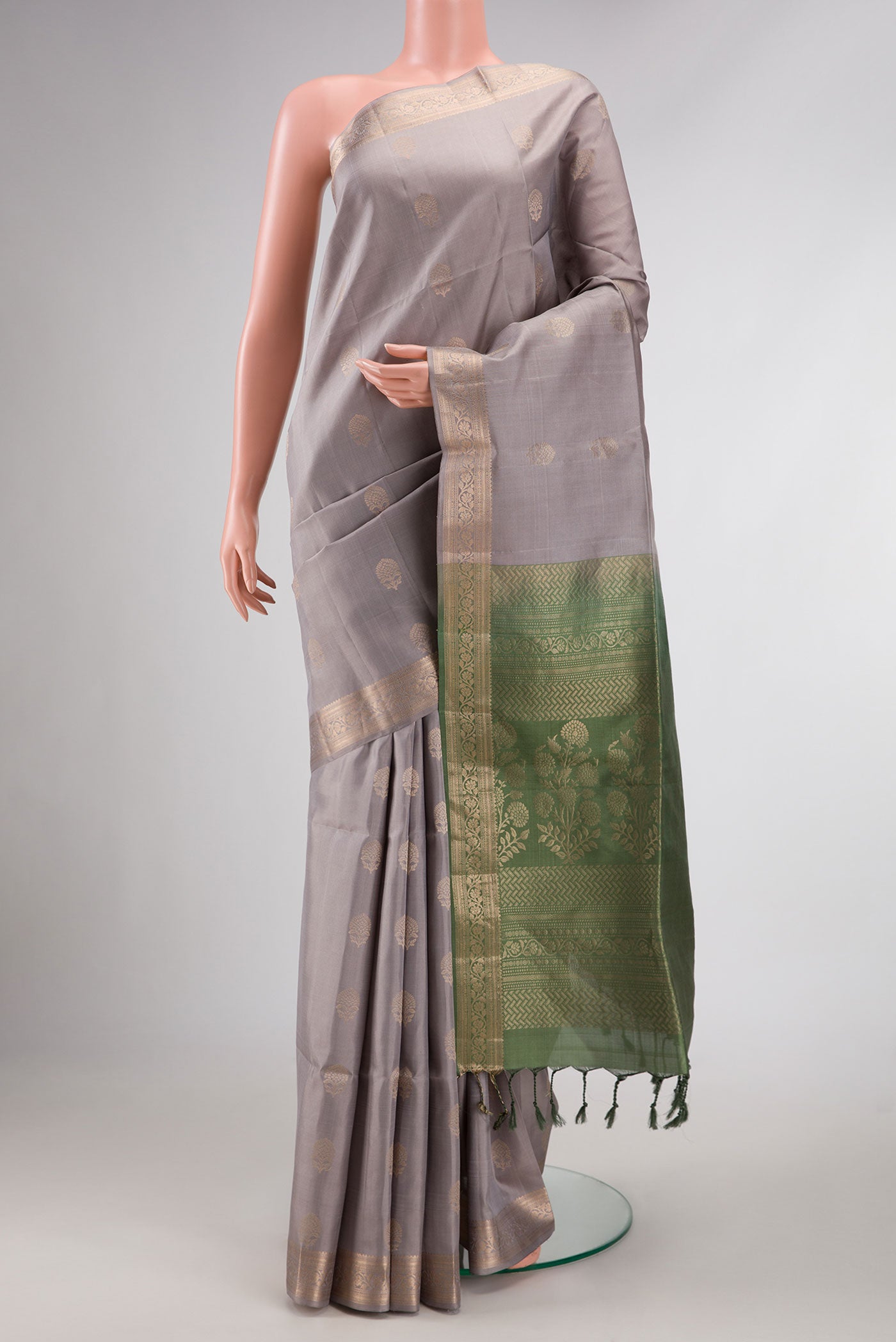 Grey Dual Tone Soft Silk Saree with Zari Butta on the body and Zari Border displayed on a mannequin