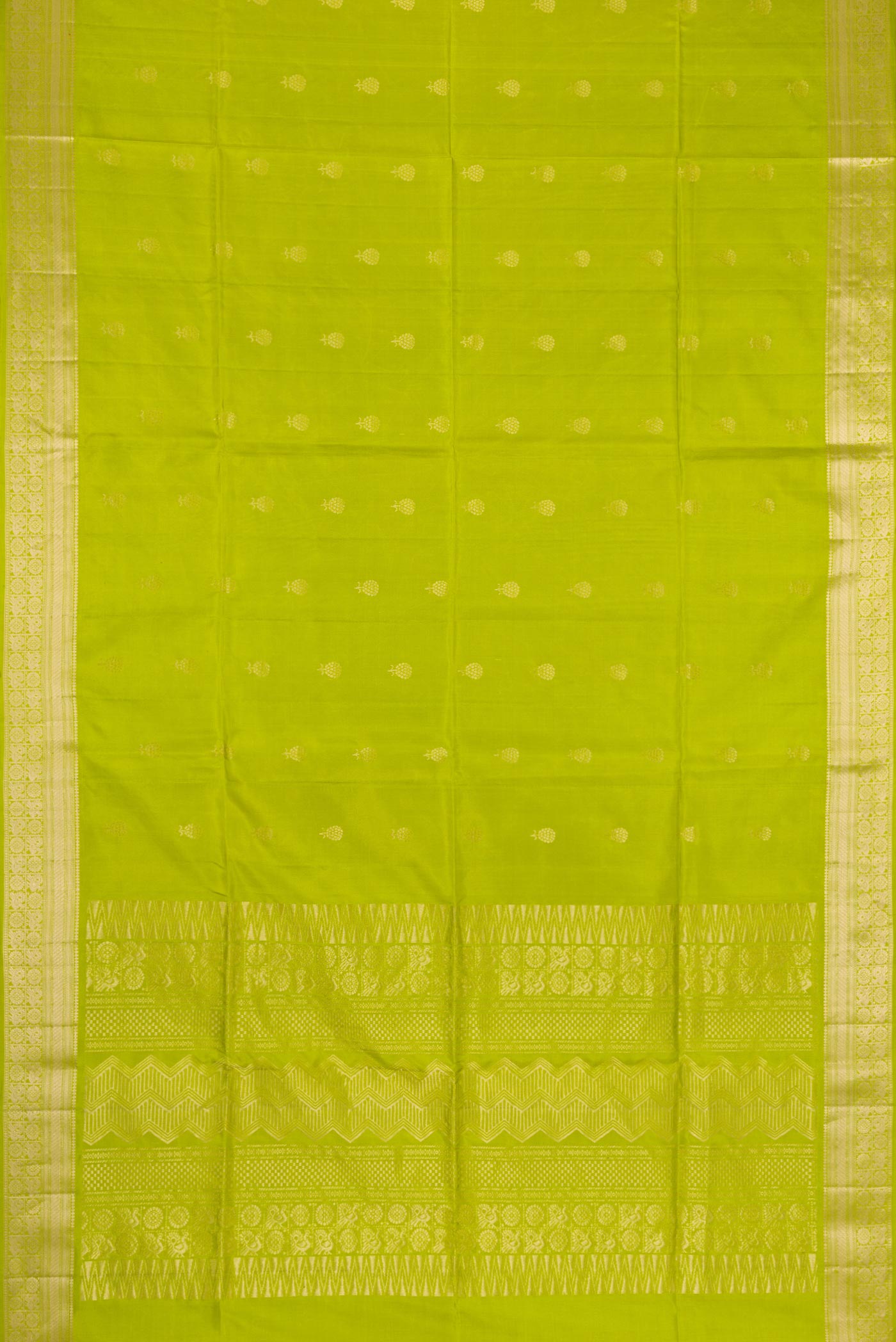 Flat view of Parrot Green Dual Tone Soft Silk Saree with Zari Butta on the body and Zari Border. 