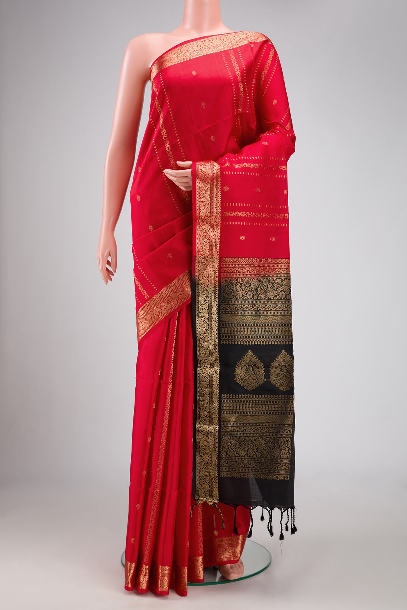 Red Dual Tone Soft Silk Saree with Stripes on the body and Zari Border.  displayed on a mannequin