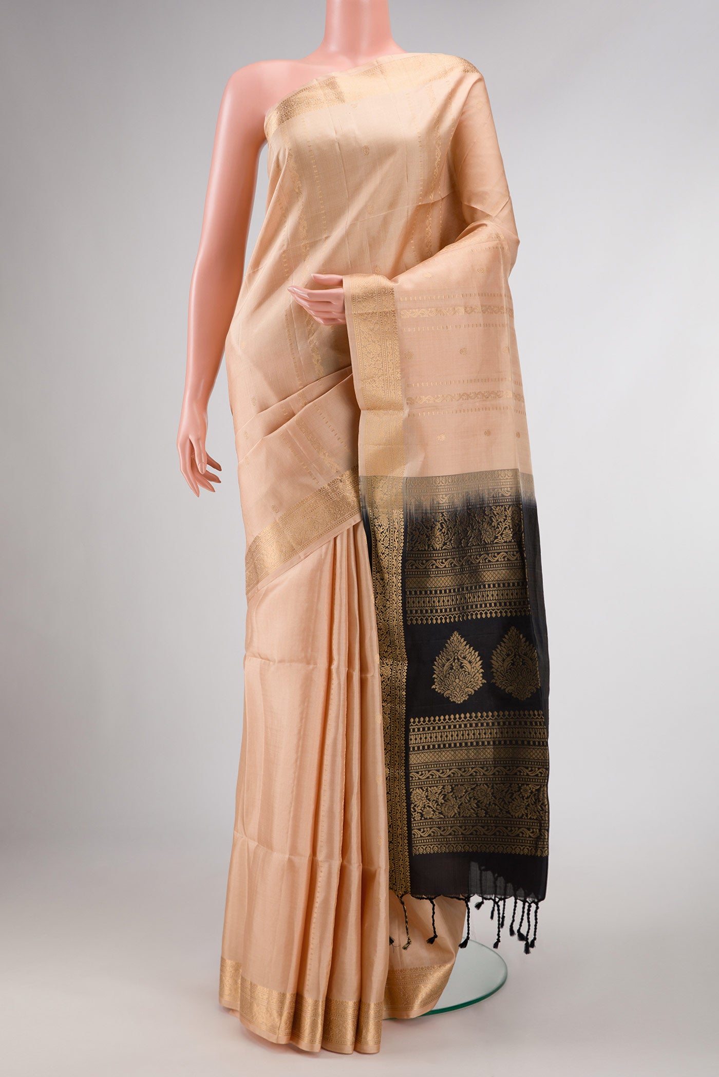 Sandal Dual Tone Soft Silk Saree with Zari Butta on the body and Zari Border displayed on a mannequin