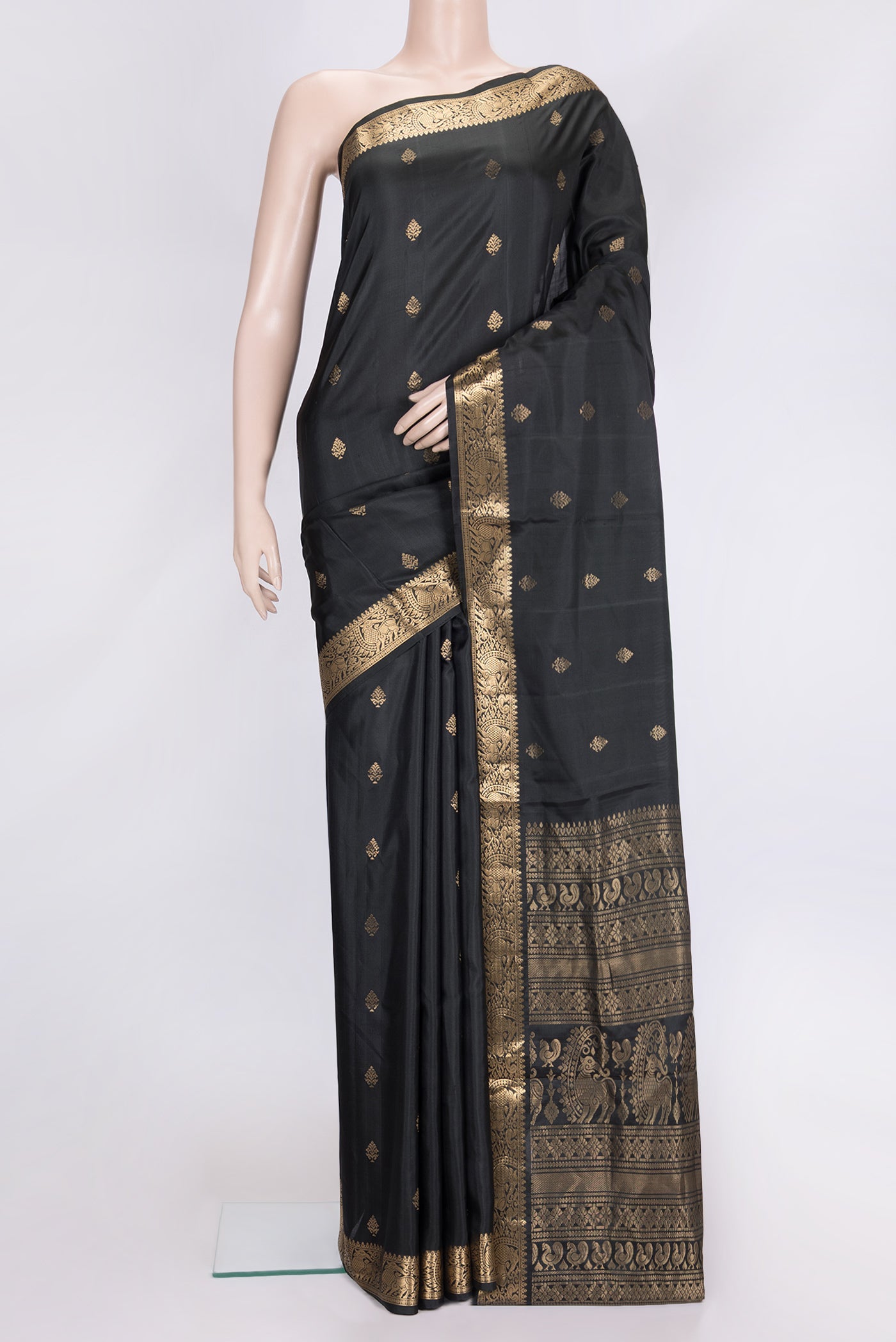Black Dual Tone Soft Silk Saree with Zari Butta on the body and Zari Border.  displayed on a mannequin