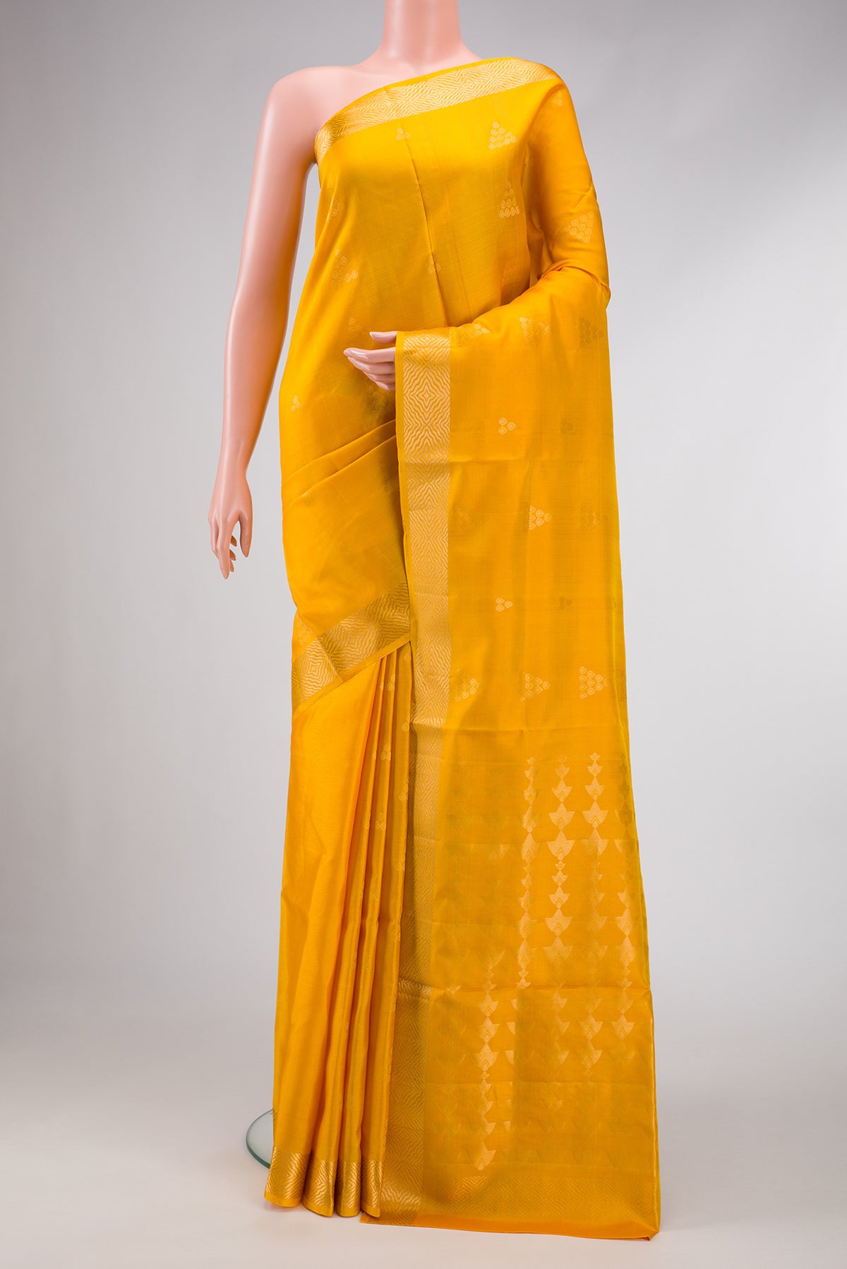 Yellow Dual Tone Soft Silk Saree with Zari Butta on the body and Zari Border.  displayed on a mannequin