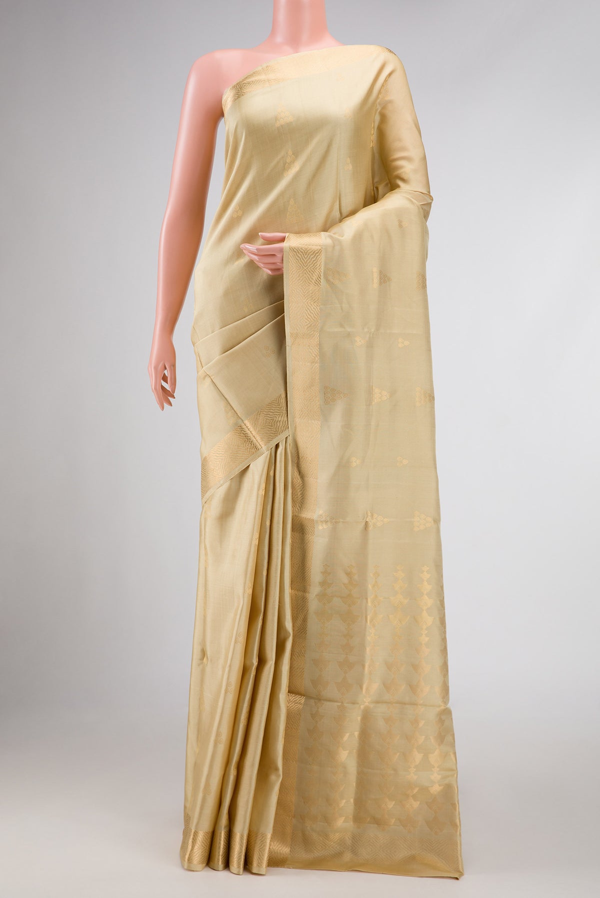 Dark Beige Dual Tone Soft Silk Saree with Zari Butta on the body and Zari Border displayed on a mannequin