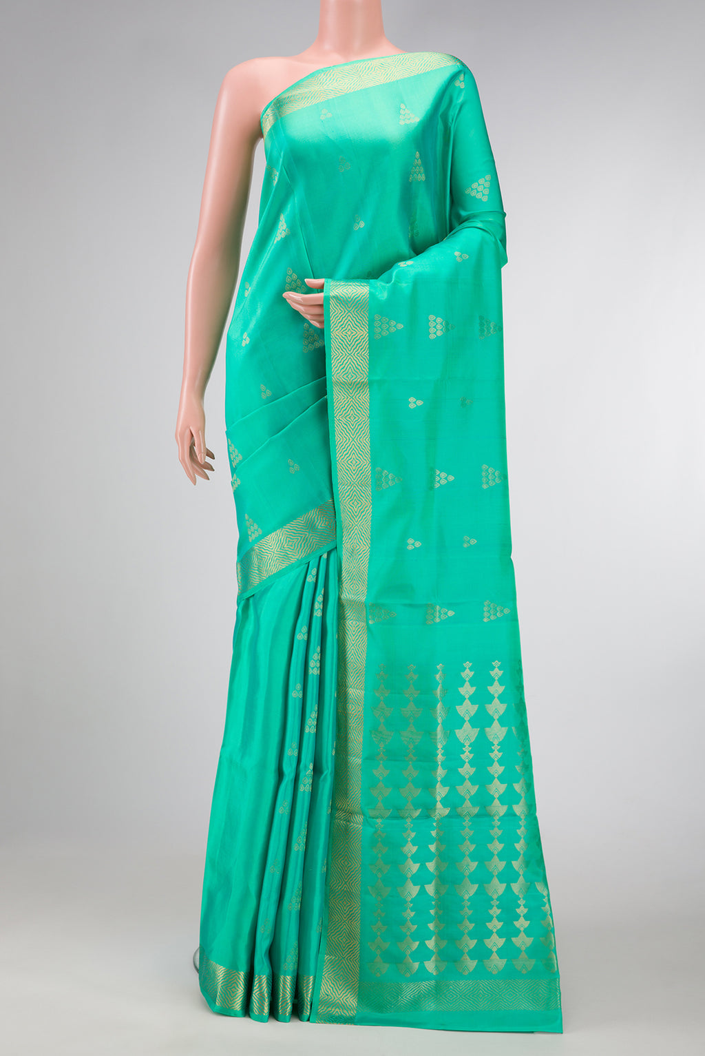 Sea Green Dual Tone Soft Silk Saree with Zari Butta on the body and Zari Border.  displayed on a mannequin