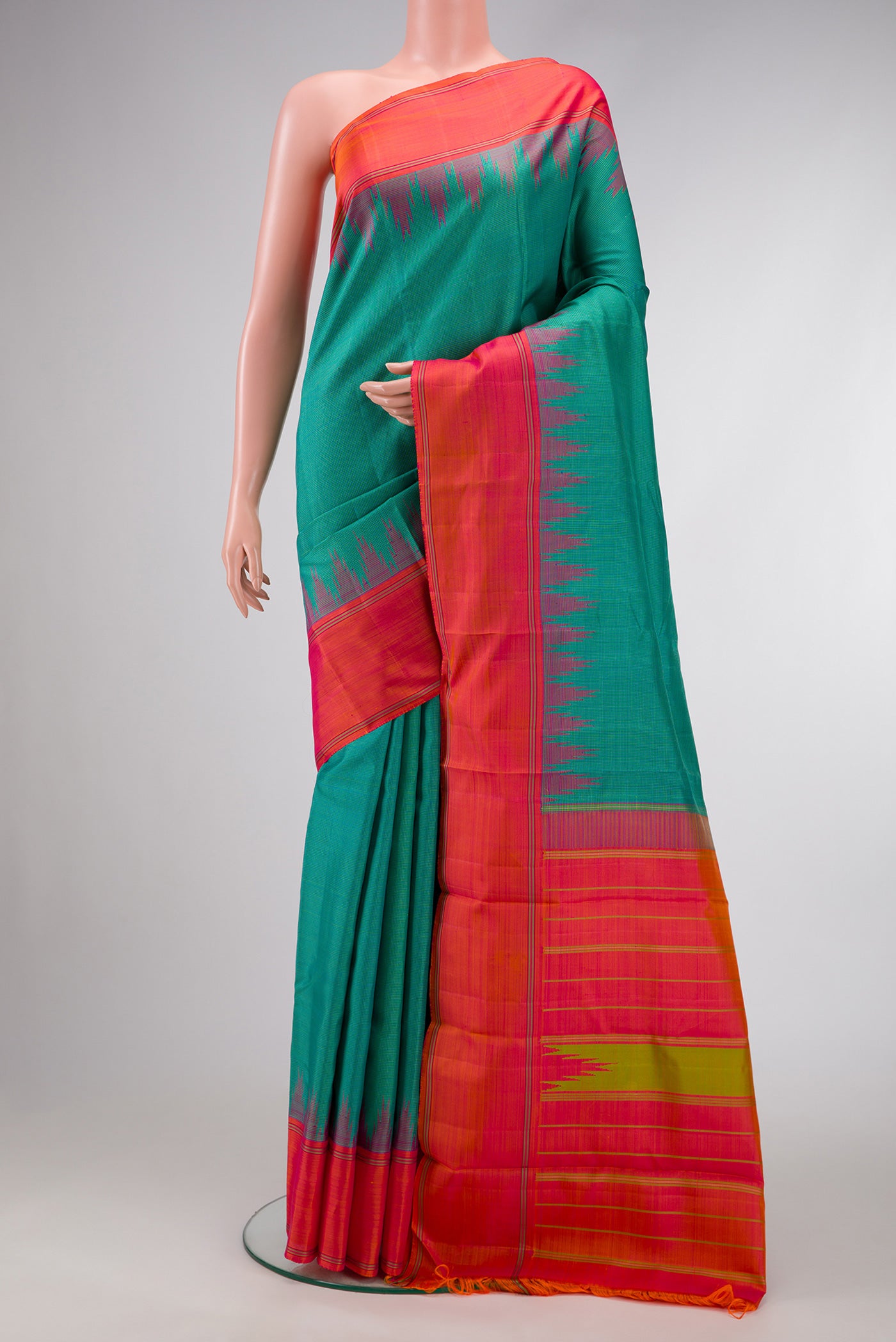 Light Green Dual Tone Kanjivaram Silk Saree with Checked design on the body and Temple Thread Border.  displayed on a mannequin