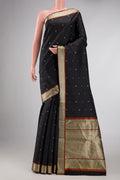 Black Dual Tone Kanchipuram Silk Saree with Thread Butta on the body and Thread Border displayed on a mannequin
