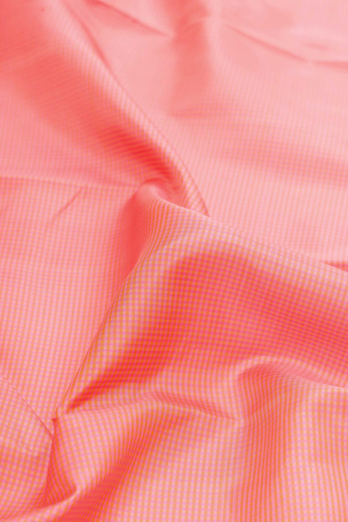 Close up of Pure Silk Pure Zari Pink Dual Tone Kanchipuram Saree with Checked design on the body and Zari Border displaying folds