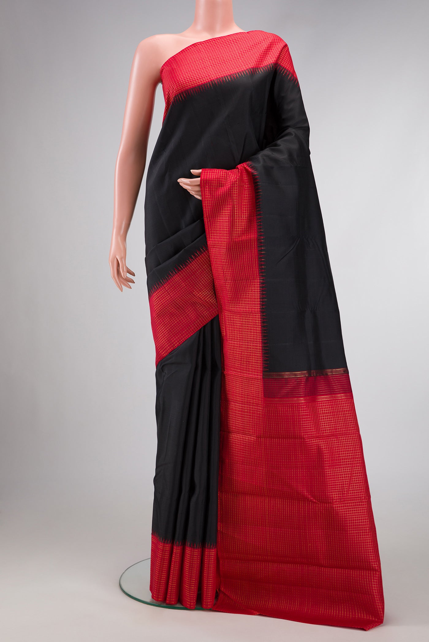 Pure Silk Pure Zari Black Dual Tone Kanchipuram Saree with Plain Body and Checks Border.  displayed on a mannequin