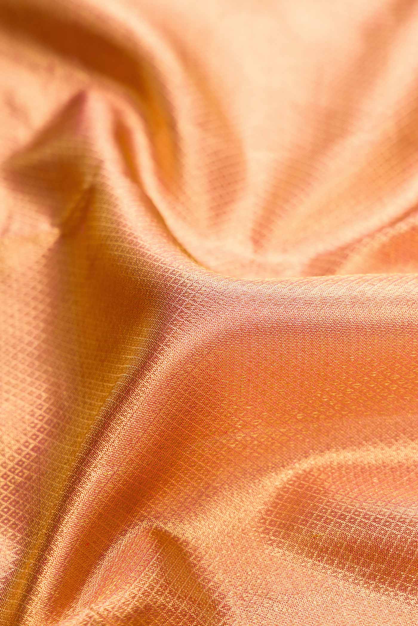 Close up of Pure Silk Pure Zari Pink Dual Tone Kanchipuram Saree with Zari Brocade on the body and Zari Border displaying folds