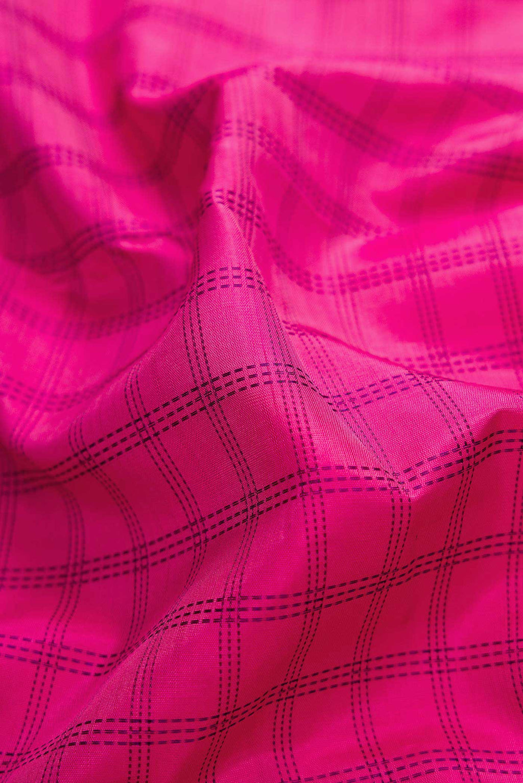 Close up of Pure Silk Pure Zari Pink Dual Tone Kanchipuram Saree with Checked design on the body and Zari Border displaying folds