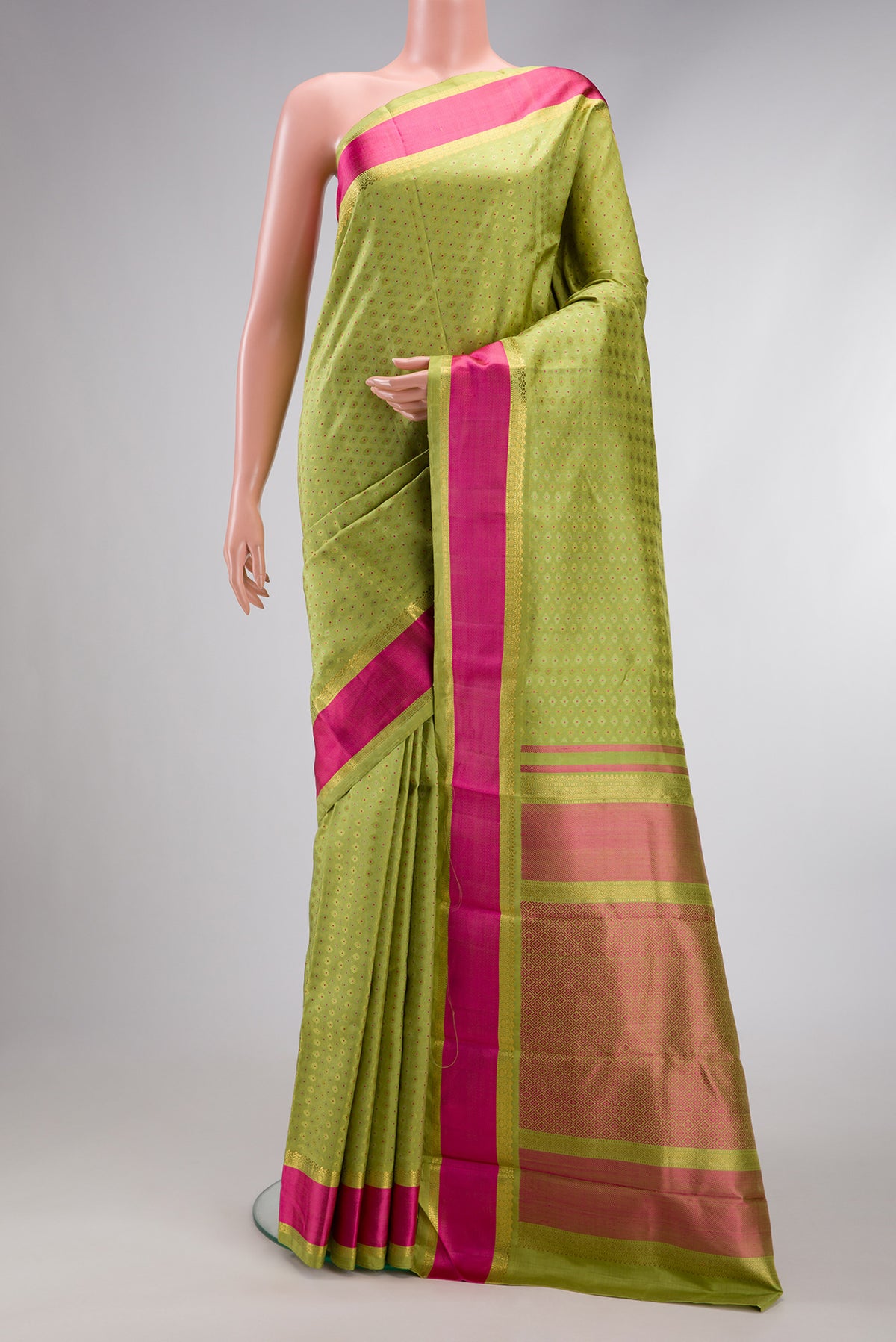 Pure Silk Pure Zari Parrot Green Dual Tone Kanchipuram Saree with Jacquard With Zari Butta on the body and Zari And Thread Border.  displayed on a mannequin