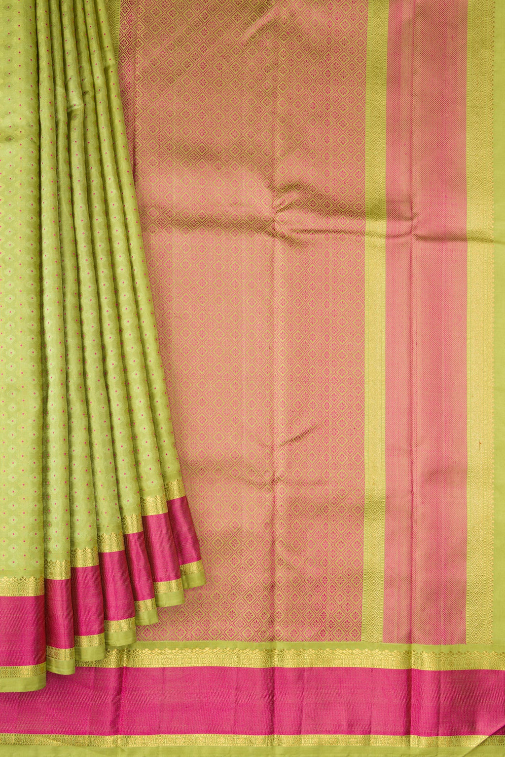 Pleats and pallu of Pure Silk Pure Zari Parrot Green Dual Tone Kanchipuram Saree with Jacquard With Zari Butta on the body and Zari And Thread Border. 