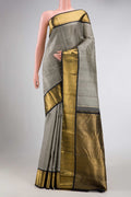 Pure Silk Pure Zari Grey Dual Tone Kanchipuram Saree with Jacquard design on the body and Zari Border displayed on a mannequin