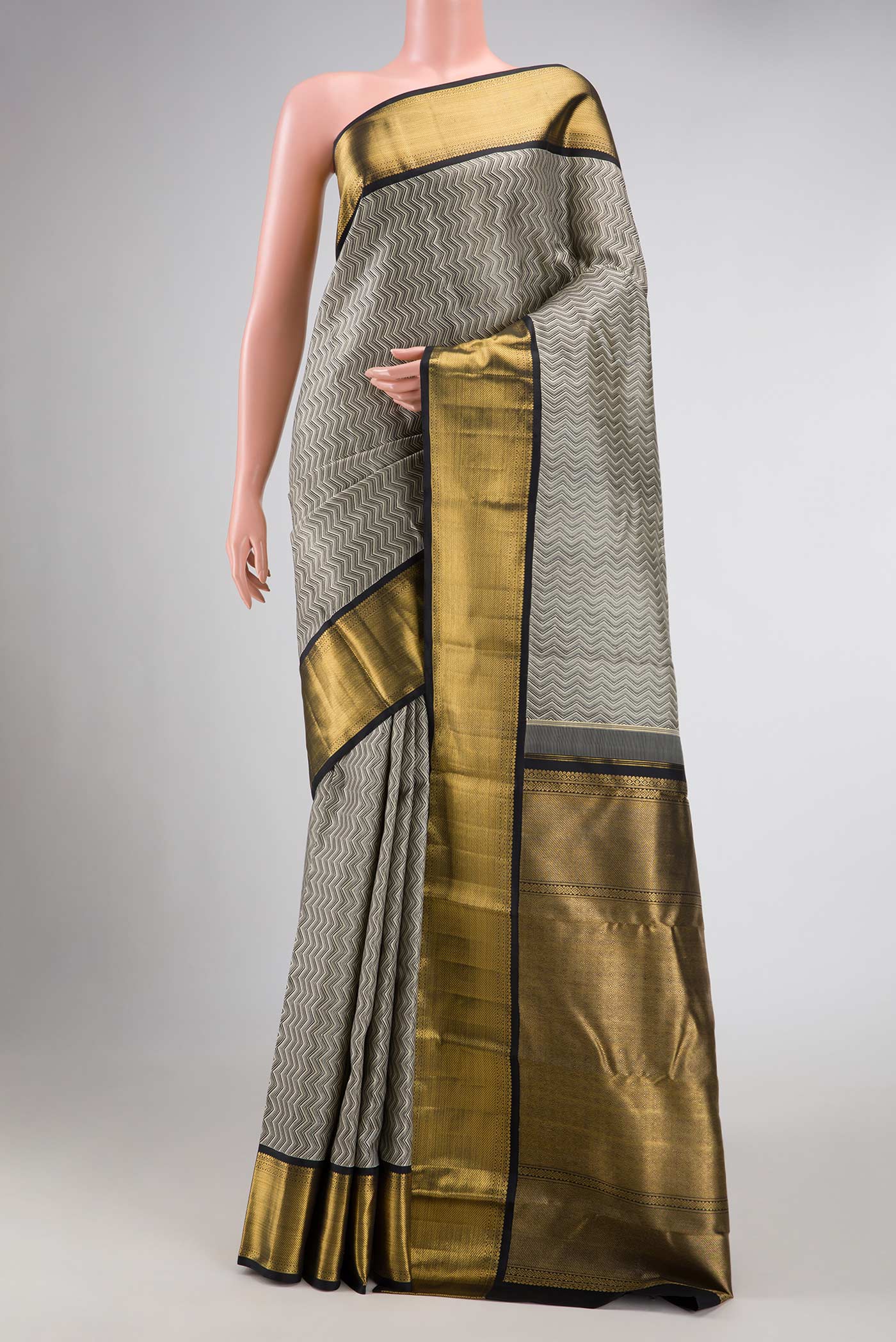 Pure Silk Pure Zari Grey Dual Tone Kanchipuram Saree with Jacquard design on the body and Zari Border displayed on a mannequin