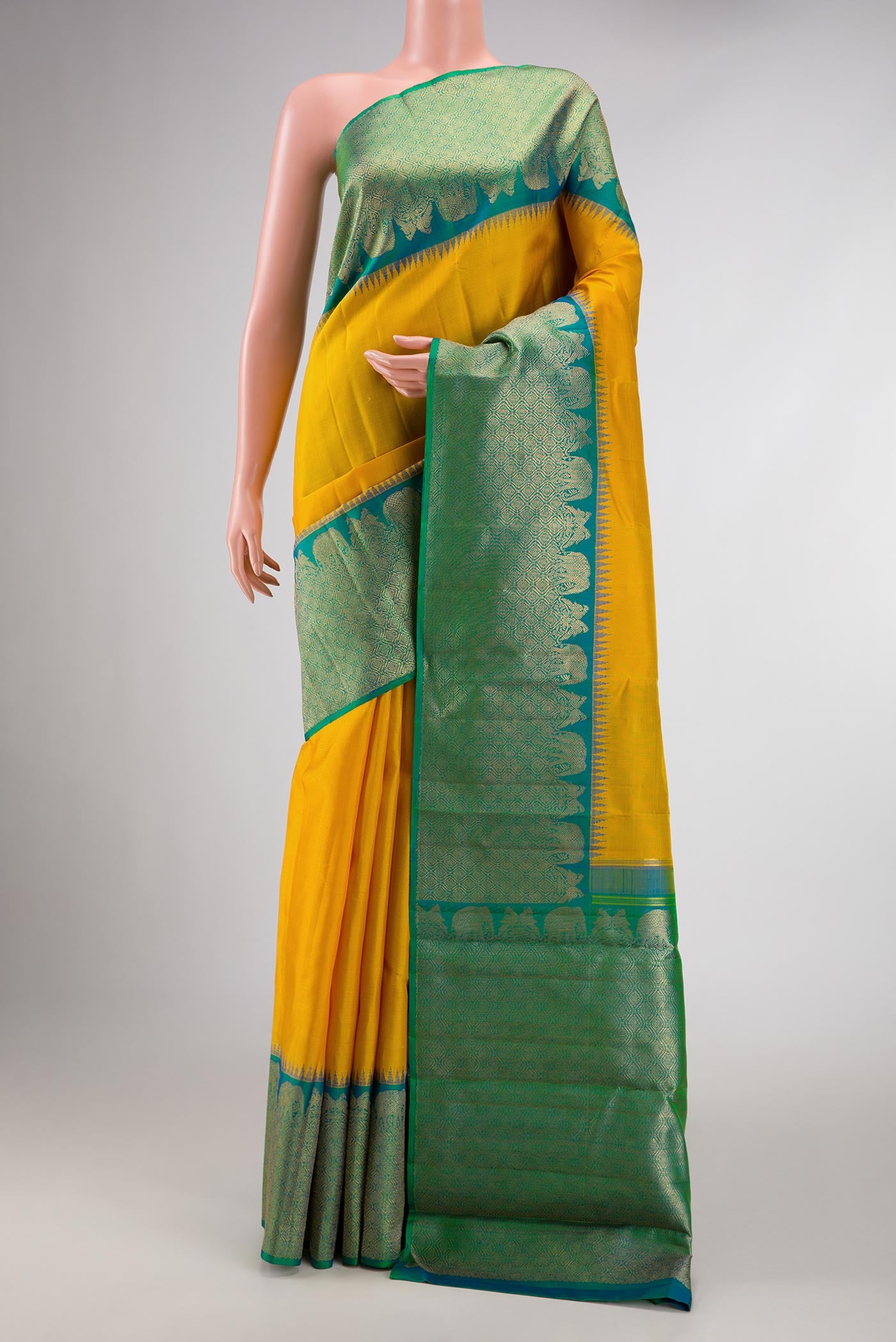 Pure Silk Pure Zari Yellow Dual Tone Kanchipuram Saree with Plain Body and Zari Border displayed on a mannequin
