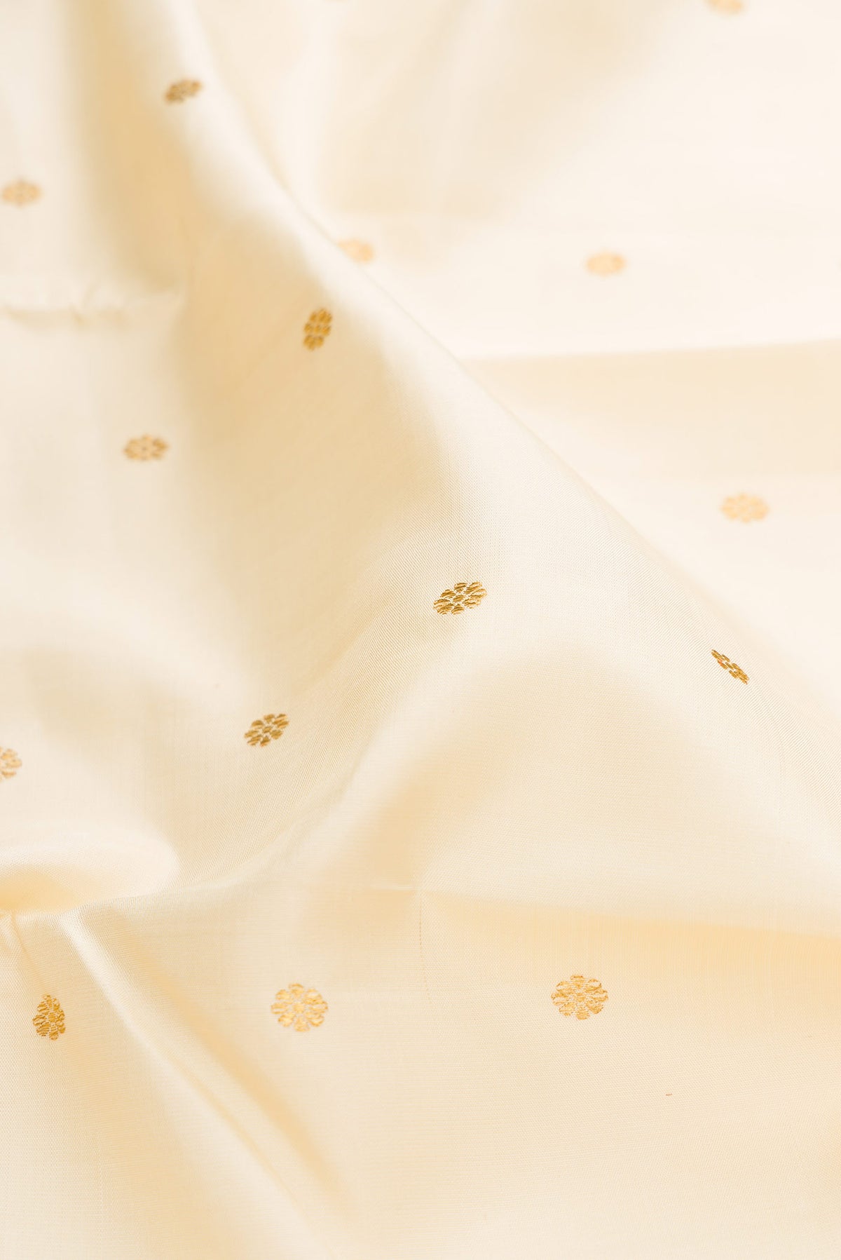 Close up of Pure Silk Pure Zari Sandal Dual Tone Kanchipuram Saree with Zari Butta on the body and Zari Border displaying folds