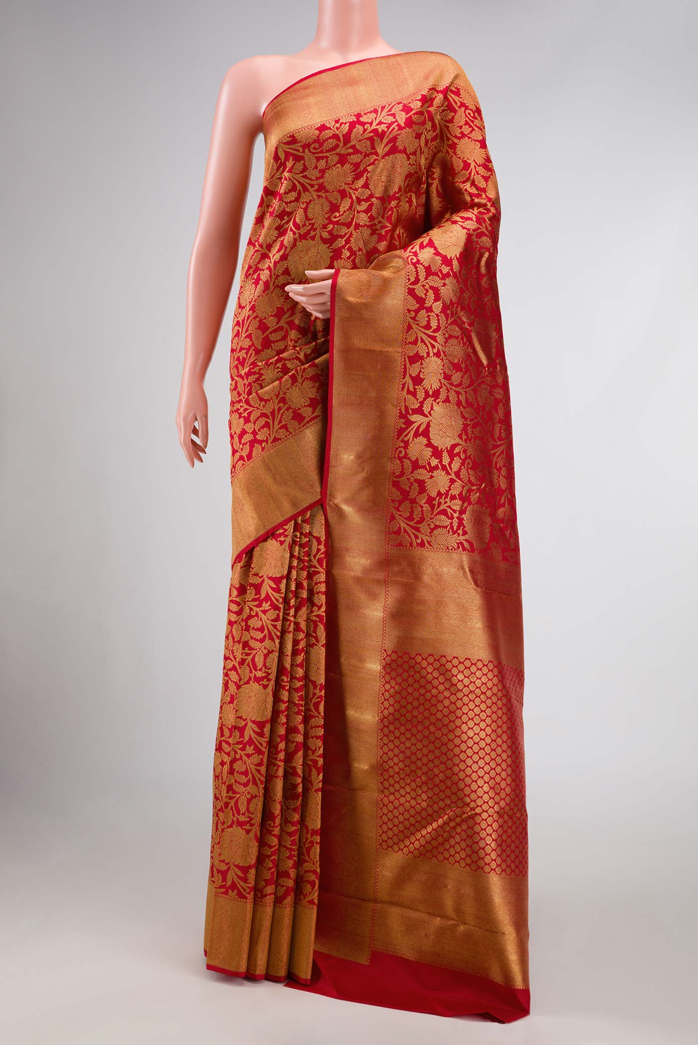 Pure Silk Pure Zari Red Dual Tone Kanchipuram Saree with Zari Brocade on the body and Zari Border displayed on a mannequin