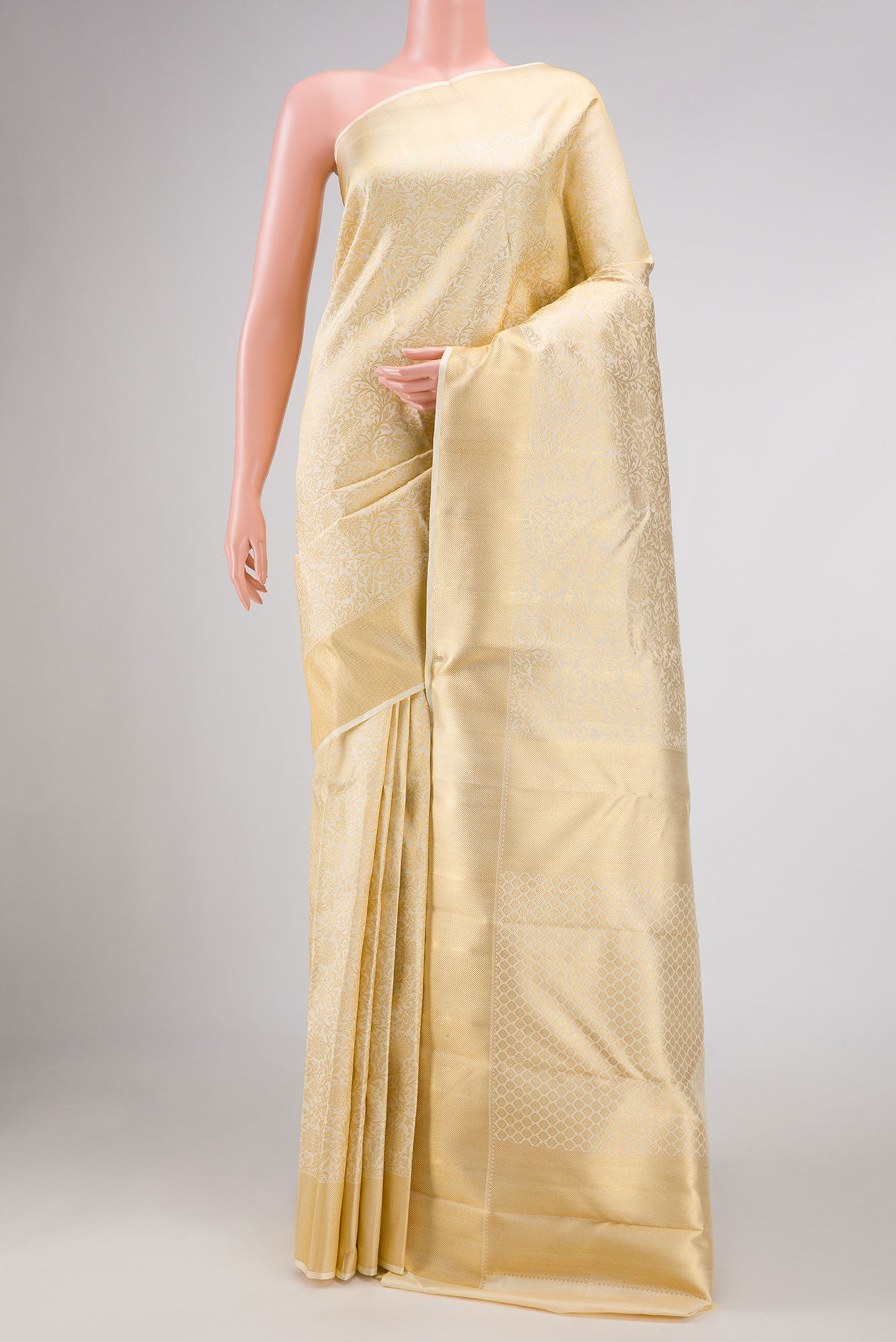 Pure Silk Pure Zari Off White Dual Tone Kanchipuram Saree with Zari Brocade on the body and Zari Border displayed on a mannequin